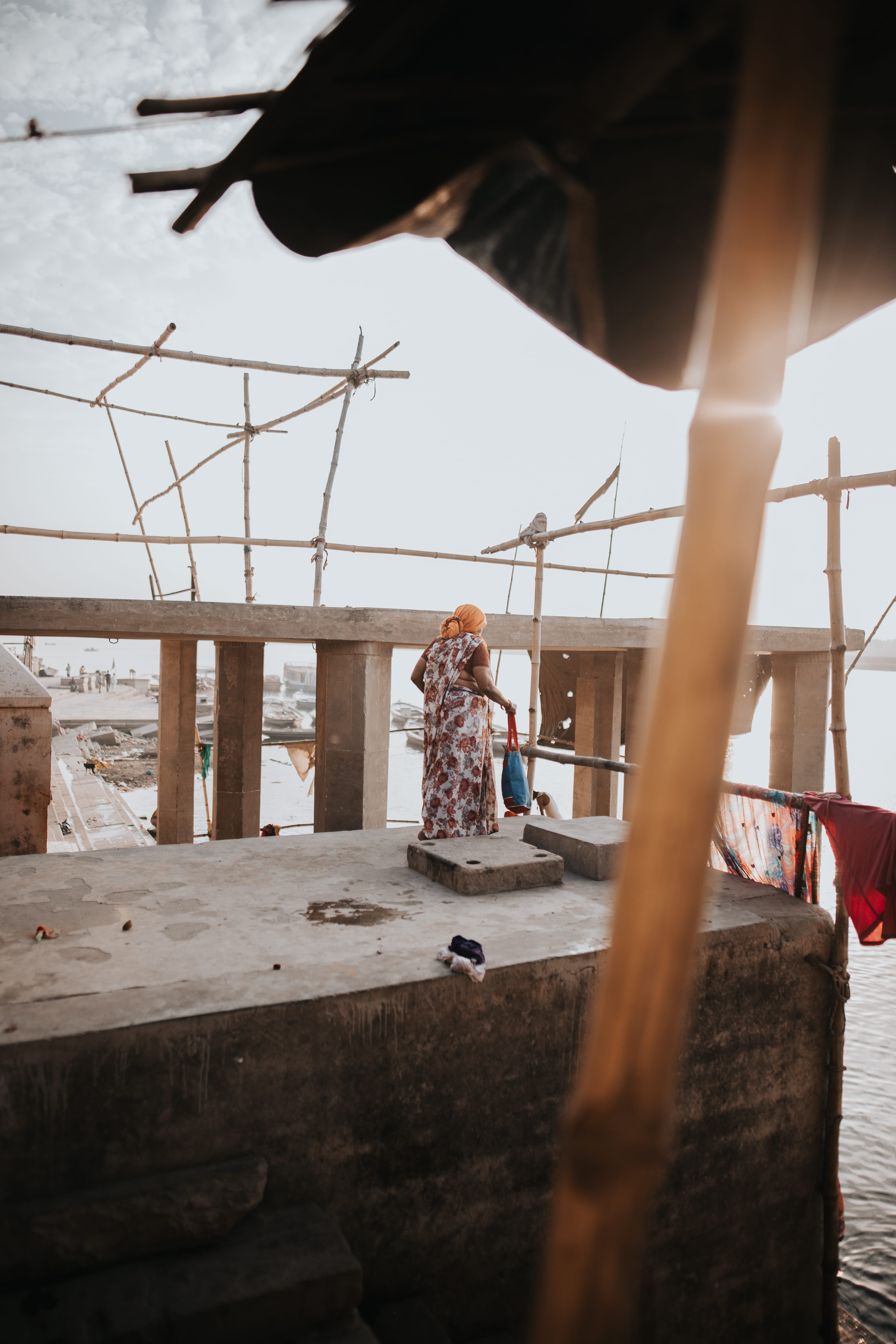 floral, travel, varanasi, river, sky, full length, water, tour, focus on background, outdoors, explore, 5K, built structure, person, morning, nature, sticks, Phone HD Wallpaper