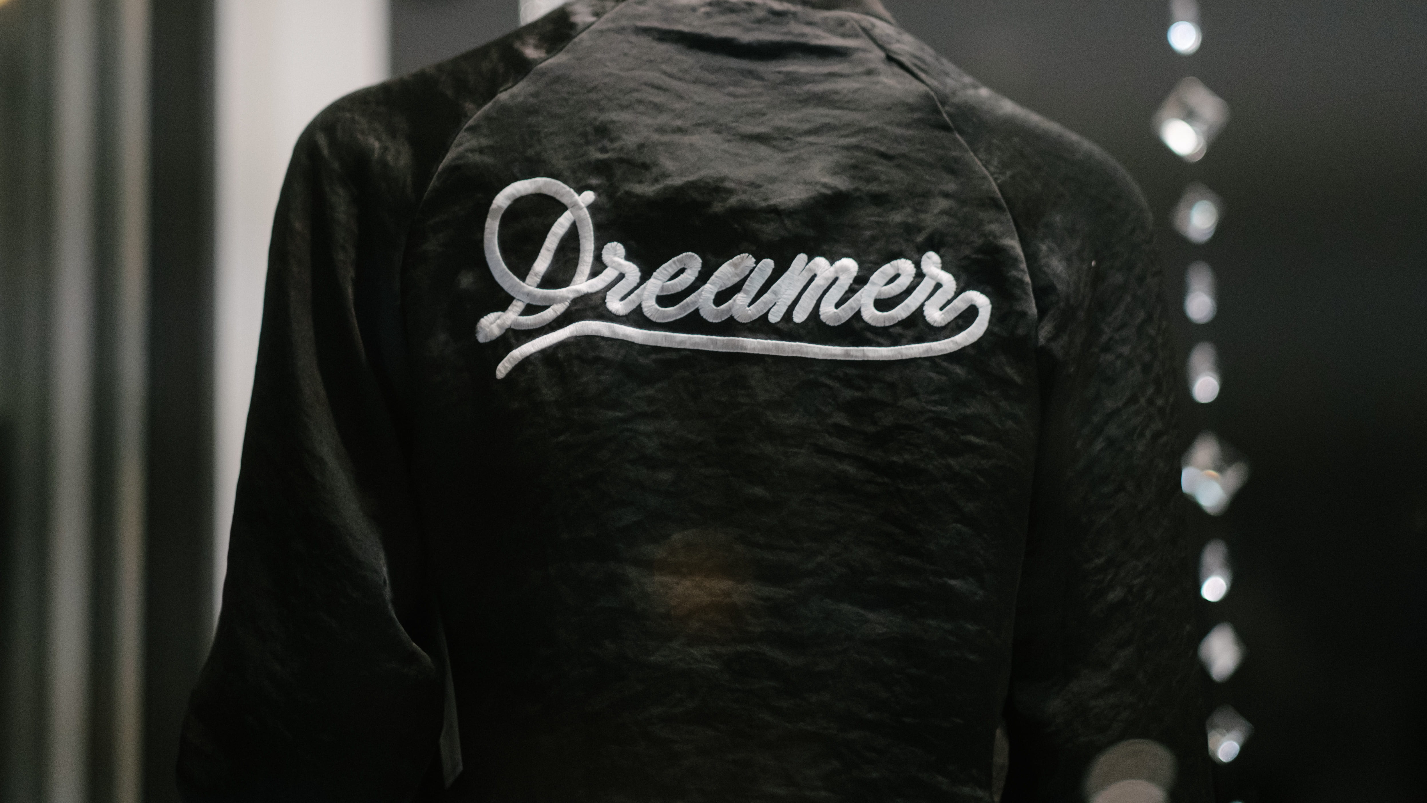 printed, dreamer, emotion, dark, person, western script, jacket, obscured face, type, headshot, one person, midsection, rear view, portrait, real people, HD Wallpaper