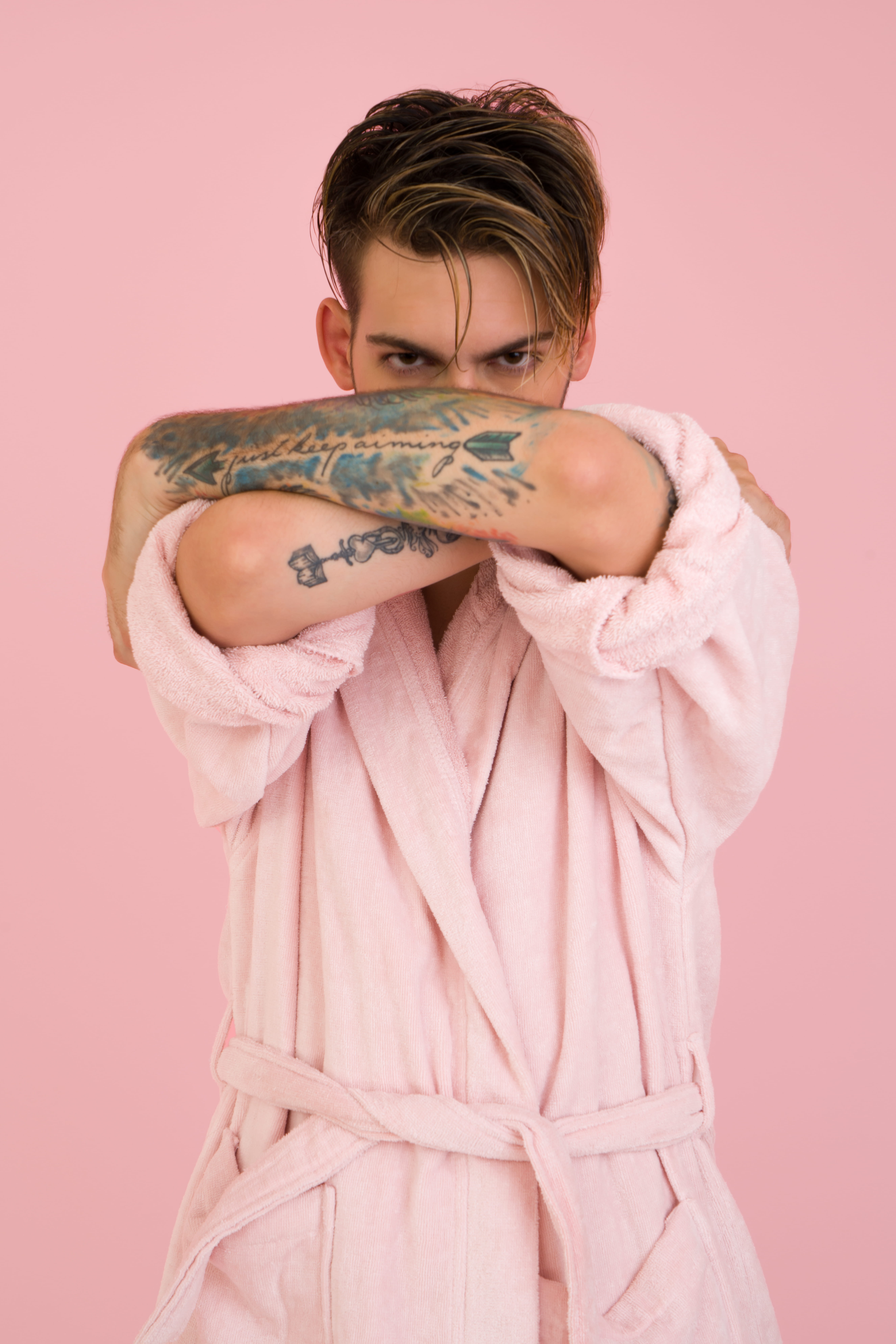 young adult, bathrobe, obscured face, eye, portrait, modern, male, man, pink, three quarter length, bath robe, pink robe, wearing, tattoo, hairstyle, colored background, Phone HD Wallpaper