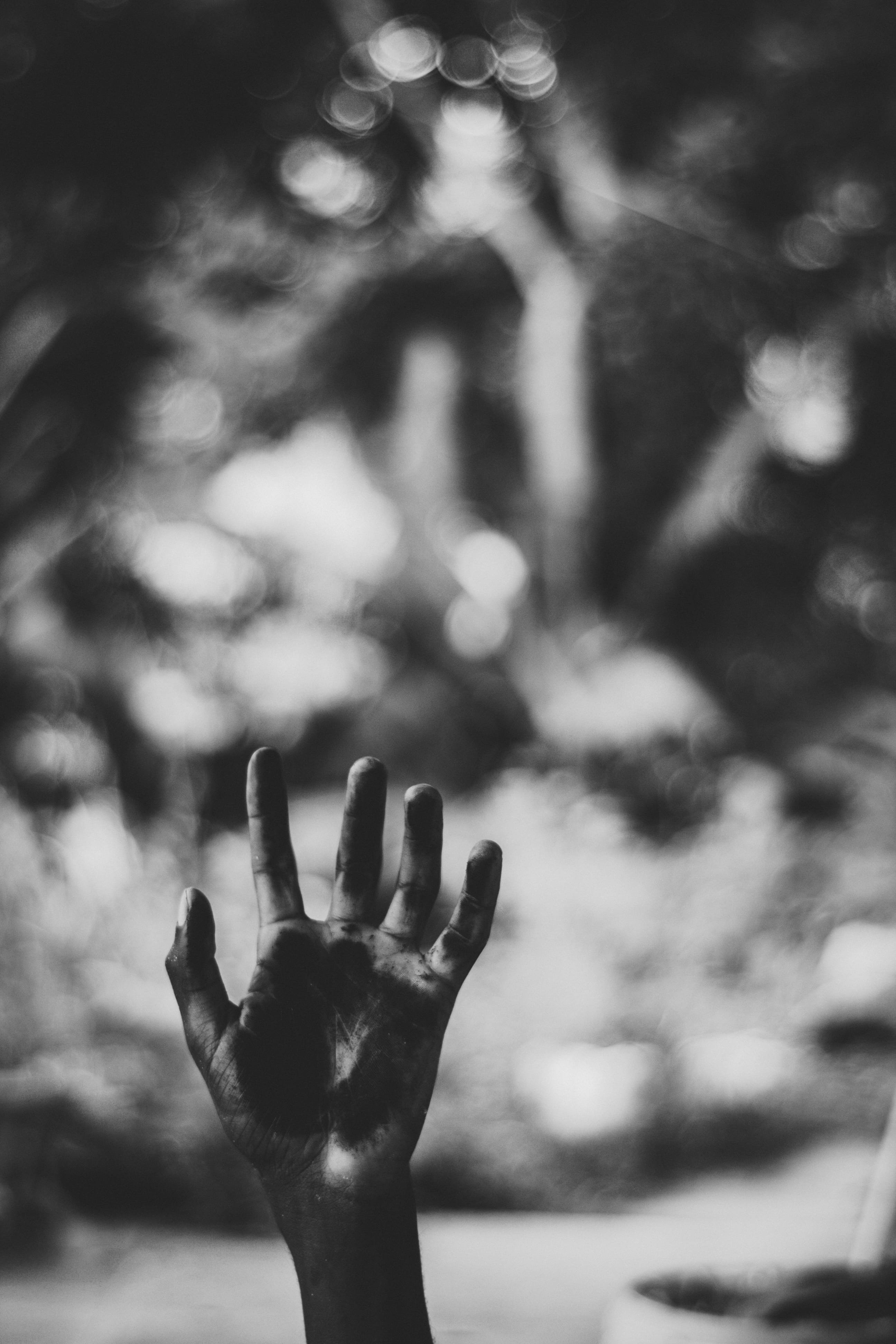 unrecognizable person, body part, hand raised, grayscale, outdoors, fingers, reaching, finger, human arm, palm, day, close-up, leisure activity, person, Phone HD Wallpaper