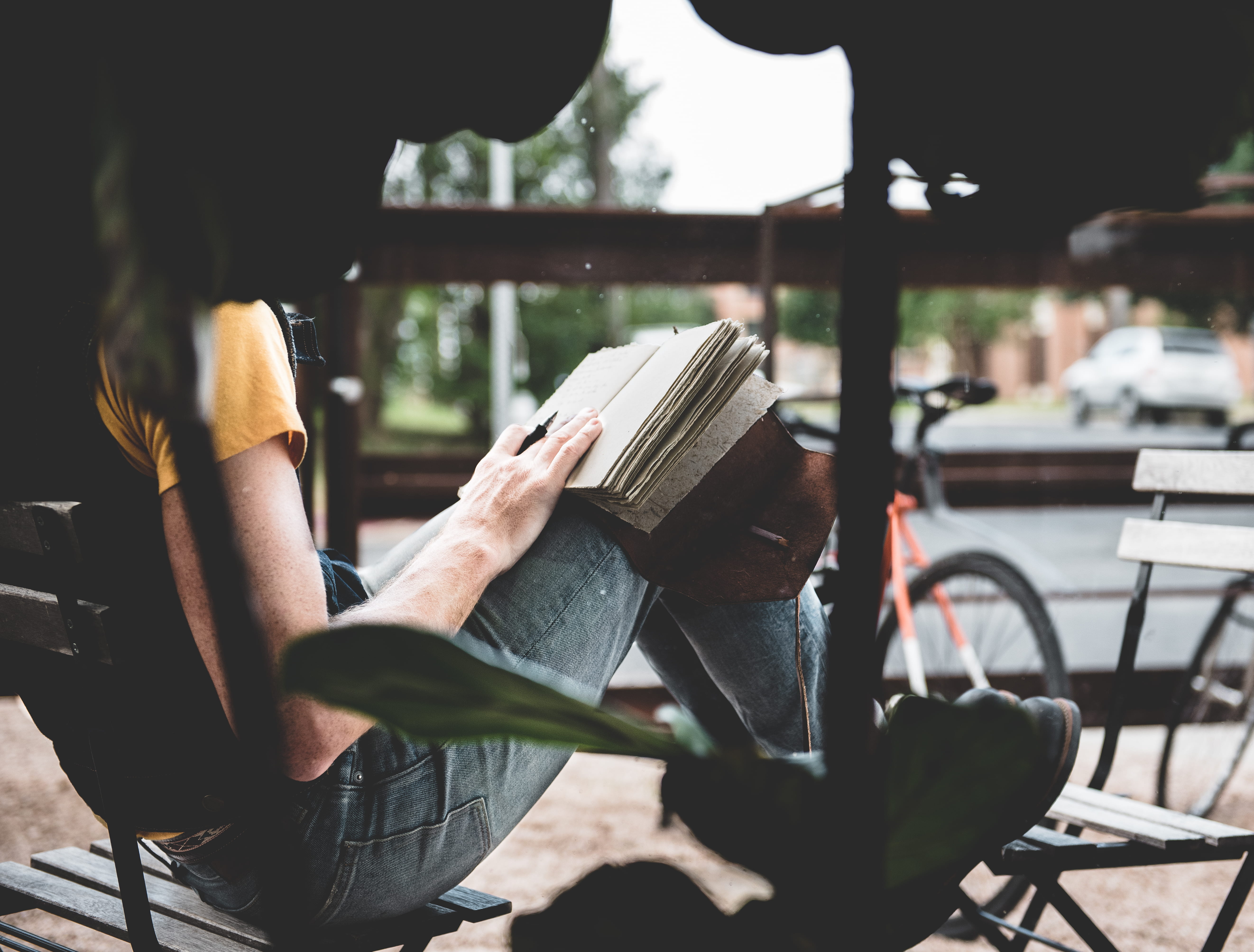 publication, cafe, daytime, book, nature, focus, near, writing, men, photography, lifestyles, sunlight, mode of transportation, austin, bench, day, selective, HD Wallpaper