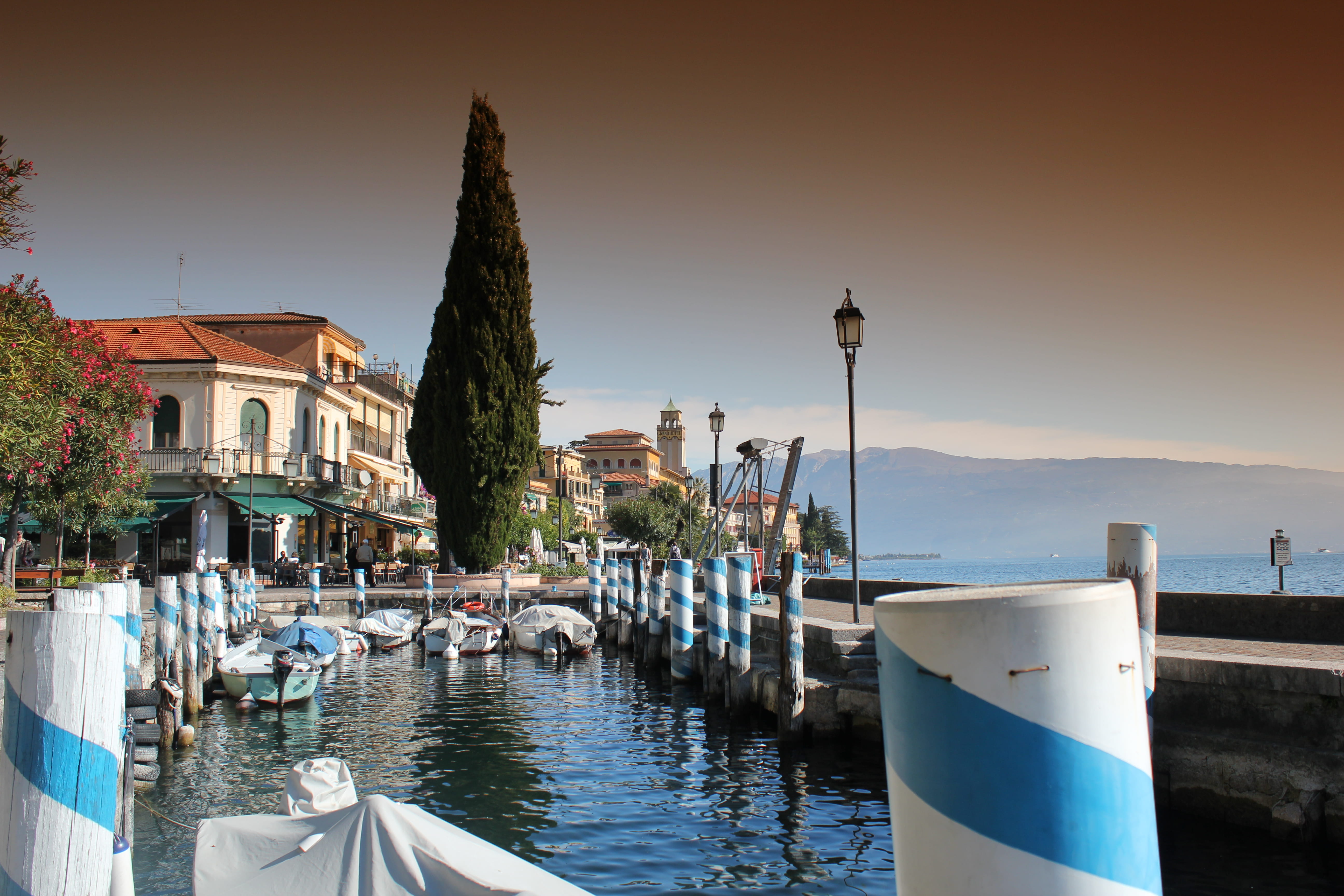 building exterior, italy, transportation, waterfront, water, city, outdoors, no people, lake garda, tower, nature, sunset, sea, mode of transportation, HD Wallpaper