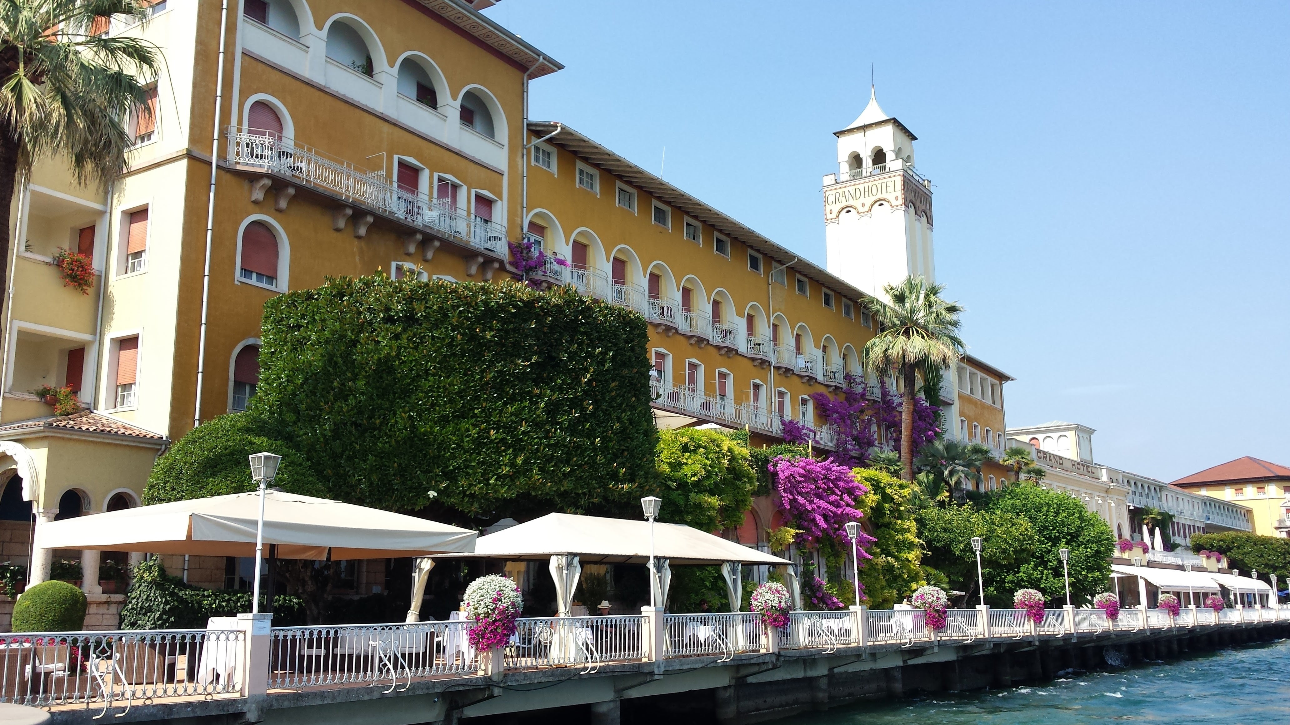 village, travel destinations, outdoors, gardone, clear sky, railing, tower, city, incidental people, tree, built structure, architecture, holiday, lake garda, HD Wallpaper