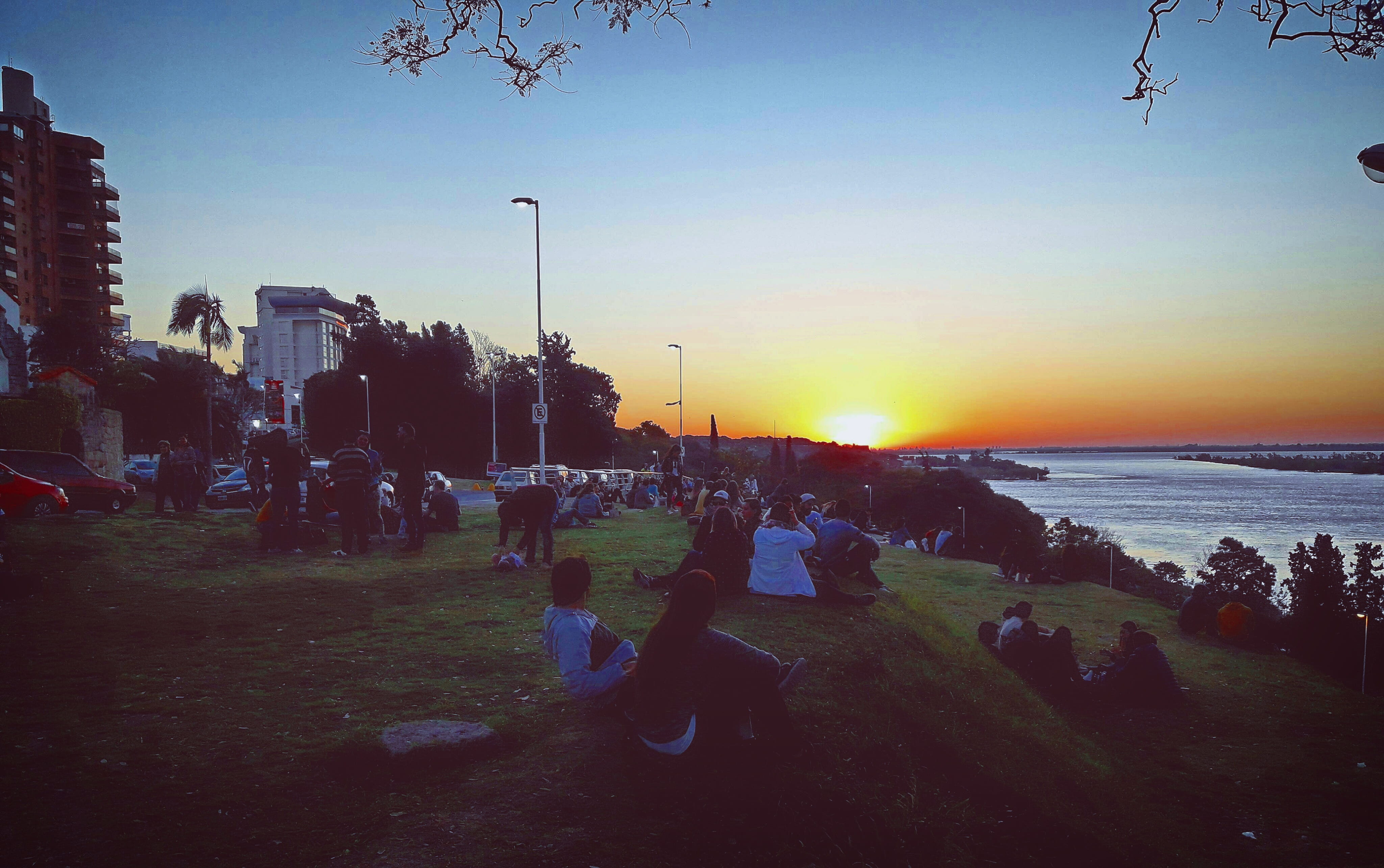 beach, parana, argentina, group of people, sitting, plant, women, men, outdoors, nature, water, land, people, sky, real people, sunset, crowd, leisure activity, HD Wallpaper