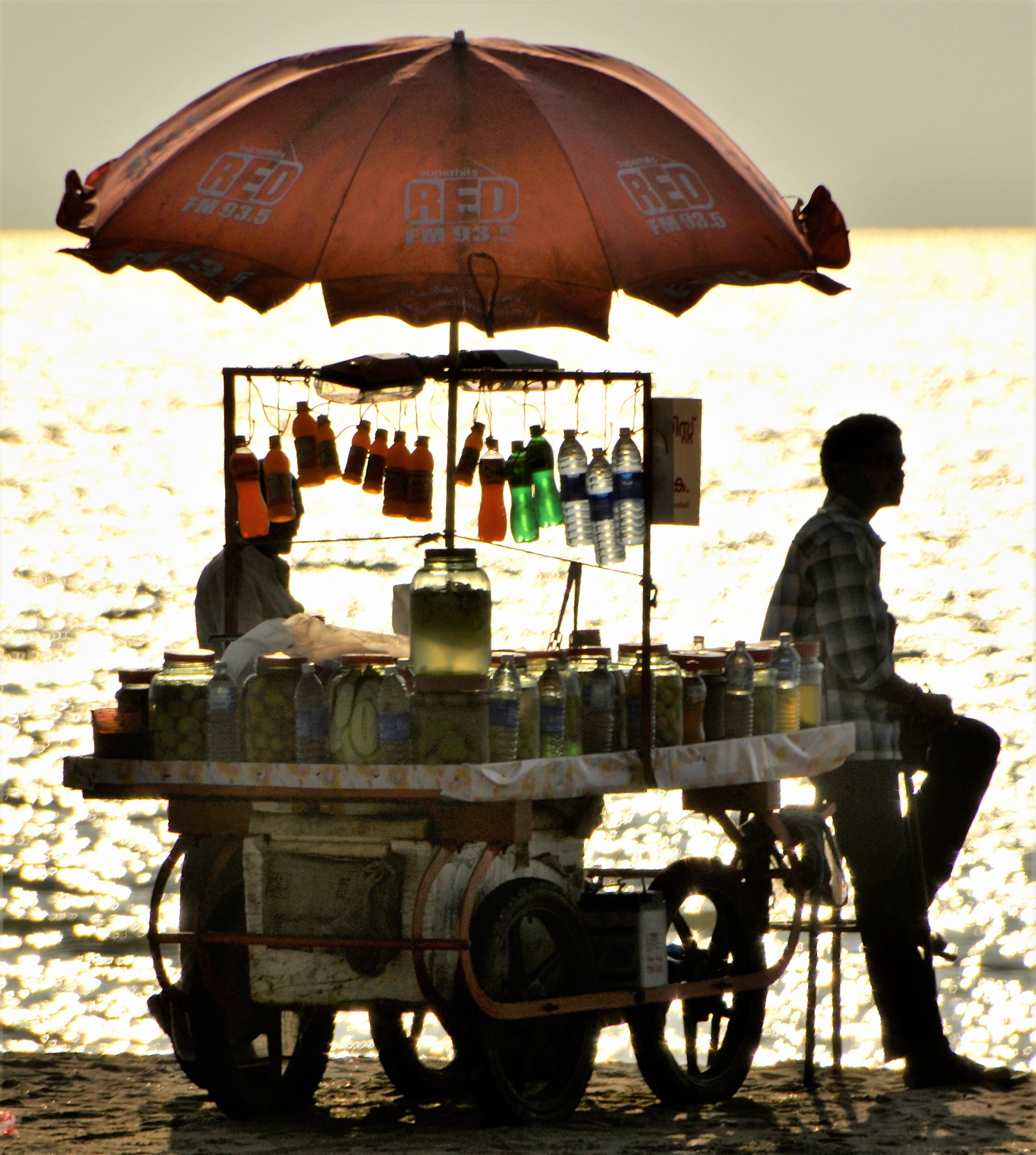 outdoors, land vehicle, umbrella, Sunset, sunlight, real people, Soft, architecture, india, adults only, adult, soft, men, sitting, Beach, group of people, Phone HD Wallpaper