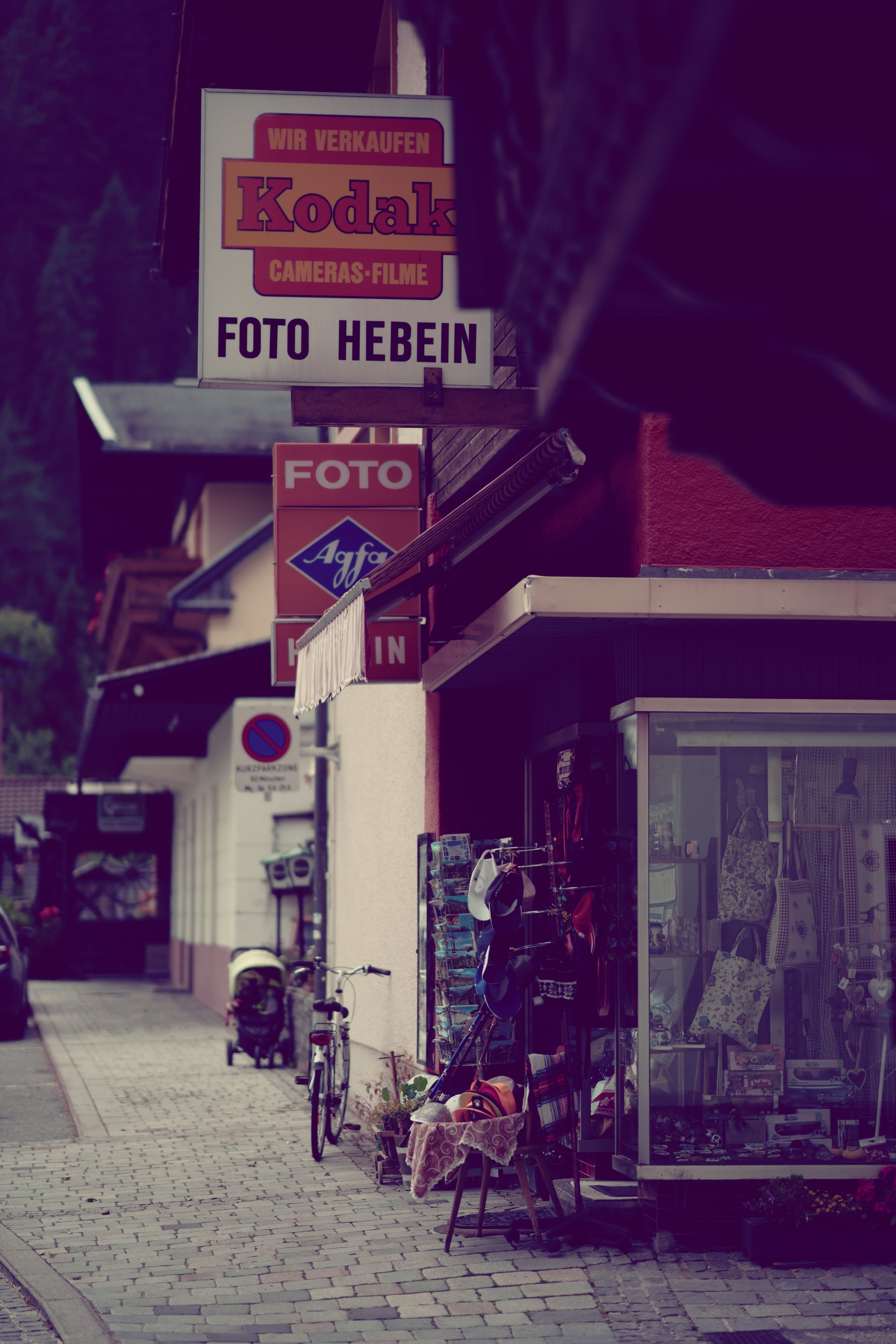 western script, building exterior, road, asphalt, guidance, information sign, day, bicycle, kiosk, path, 5K, group of people, text, sidewalk, information, Phone HD Wallpaper