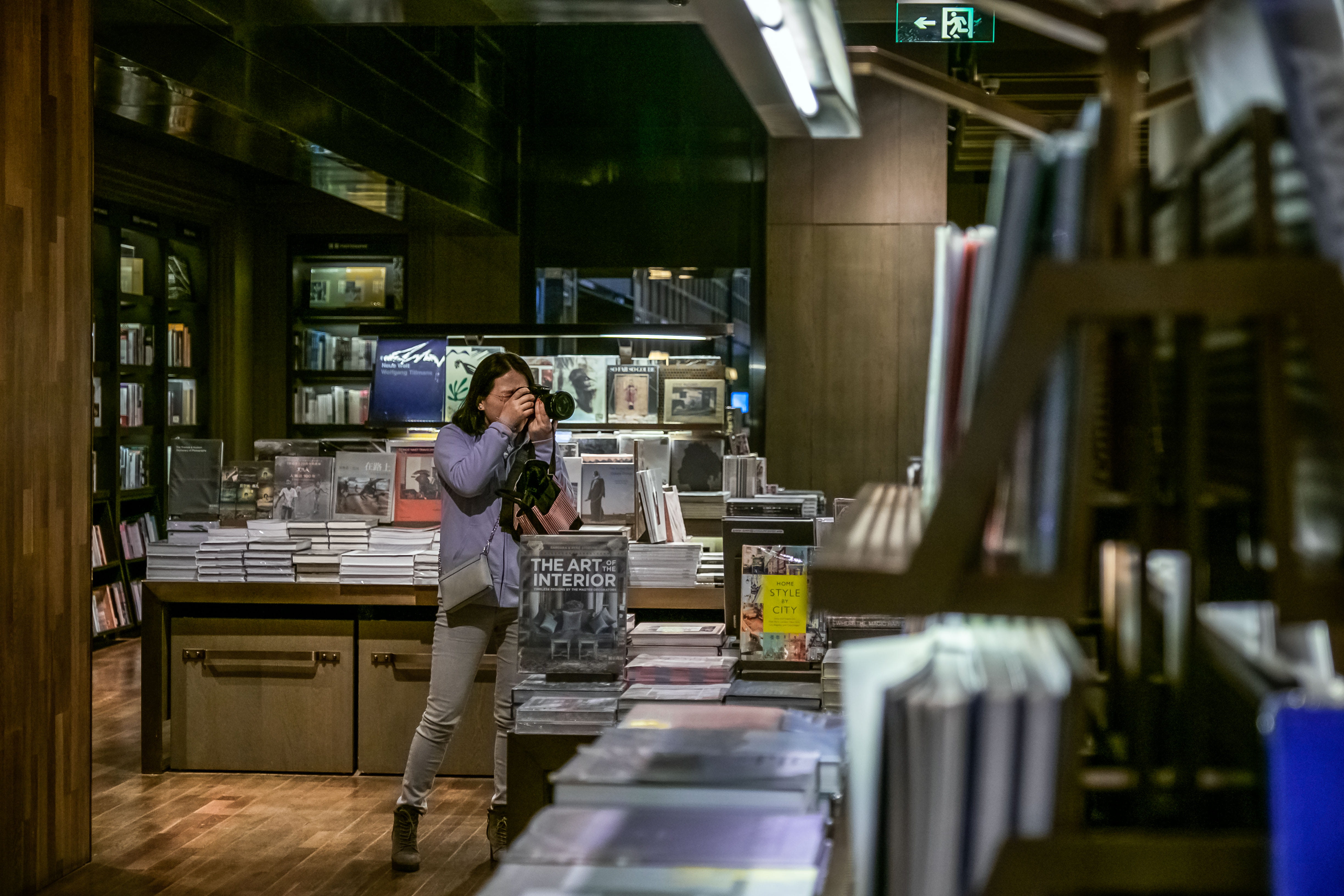 front view, business, adult, kiosk, library, indoors, selective focus, real people, shop, occupation, room, interior design, shelf, three quarter length, HD Wallpaper