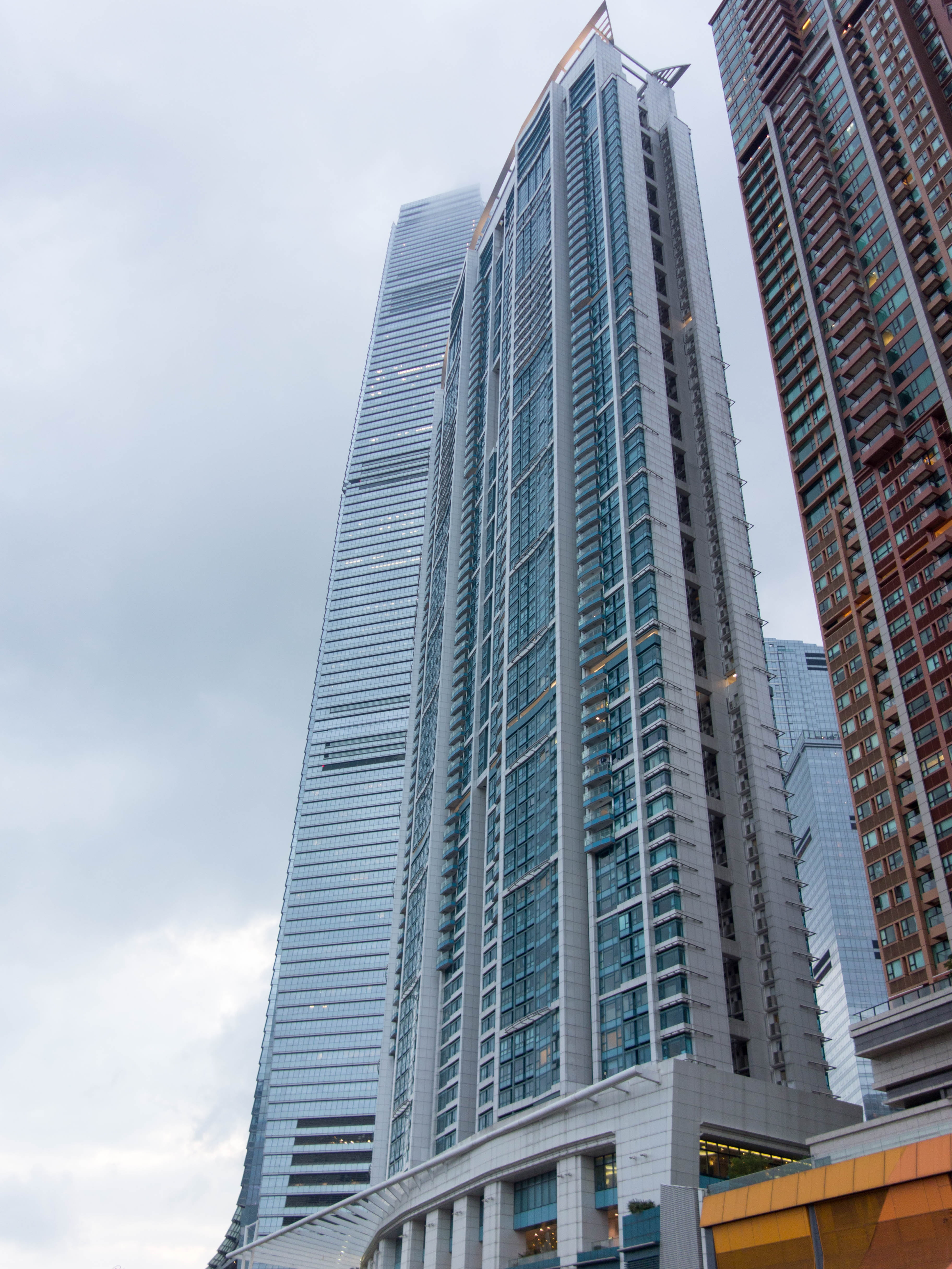 office building exterior, office, built structure, hong kong, skyscraper, tall - high, downtown district, sea, building, architecture, day, building exterior, Phone HD Wallpaper