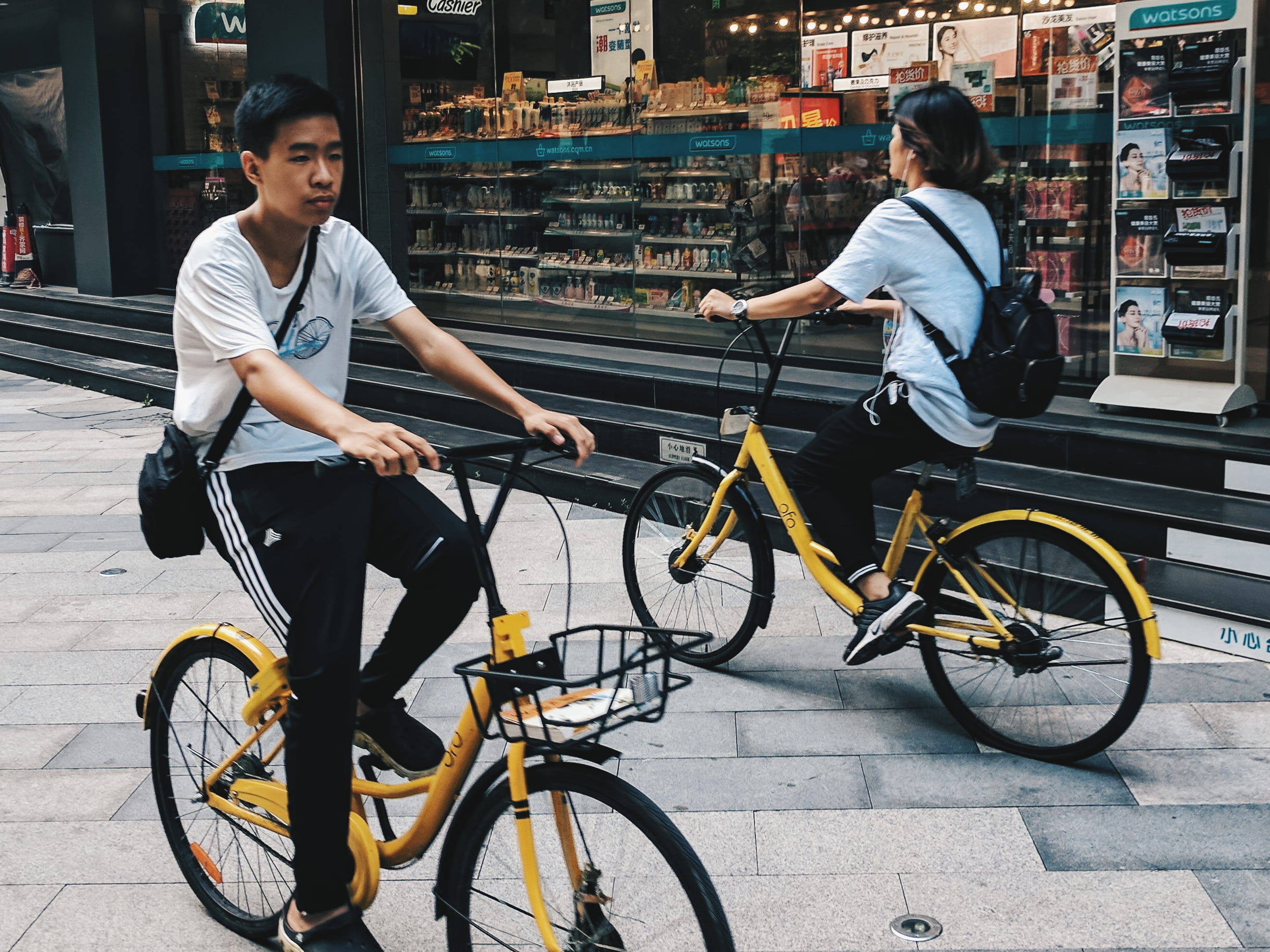 2K, riding, building exterior, land vehicle, casual clothing, store, lifestyles, asia, streetscape, pavement, chinese, full length, sitting, yellow, cycling, HD Wallpaper