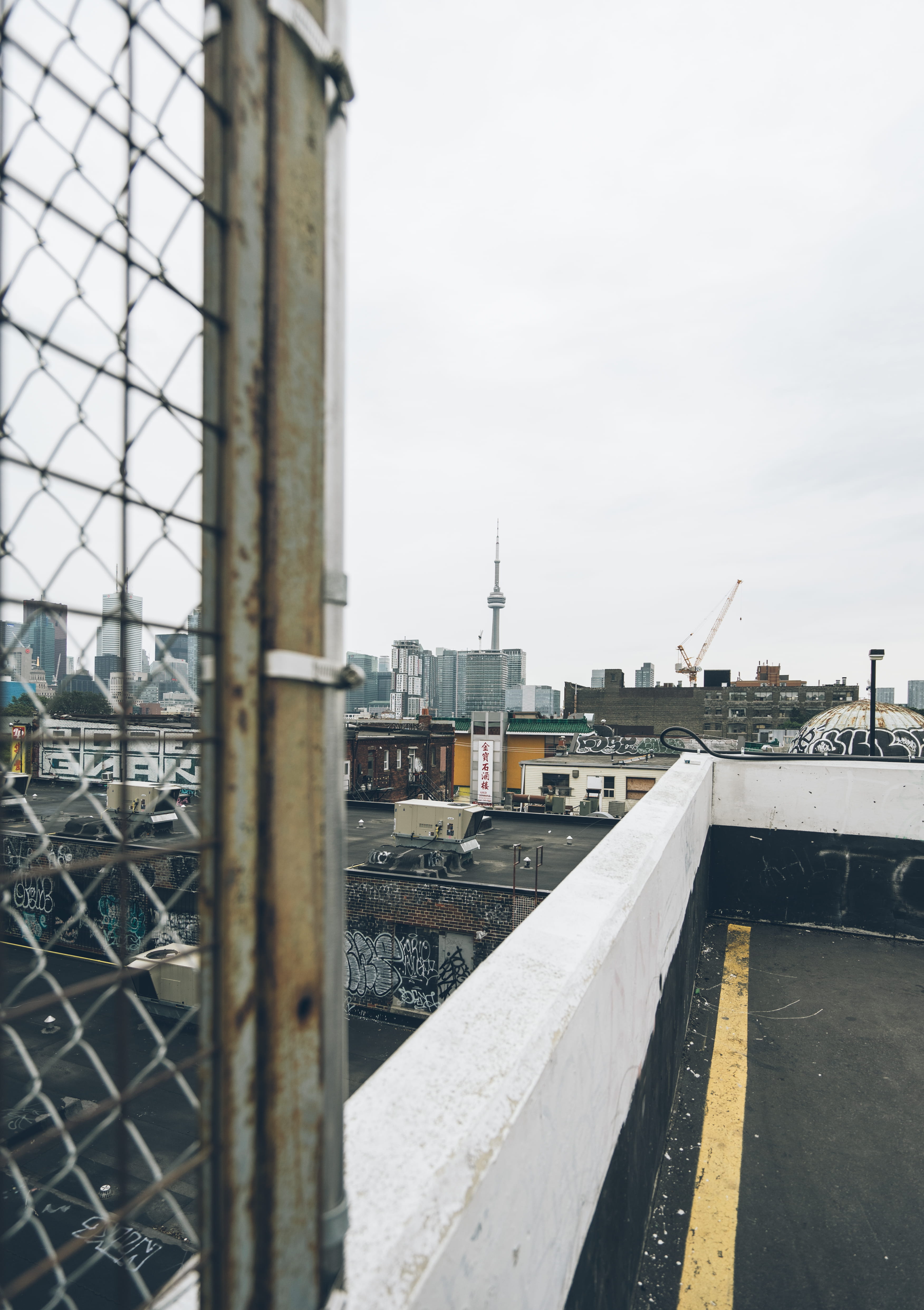 barrier, day, downtown, 4K, clear sky, overcast, building, metal, connection, travel destinations, sky, banister, kensington market, nature, built structure, Phone HD Wallpaper