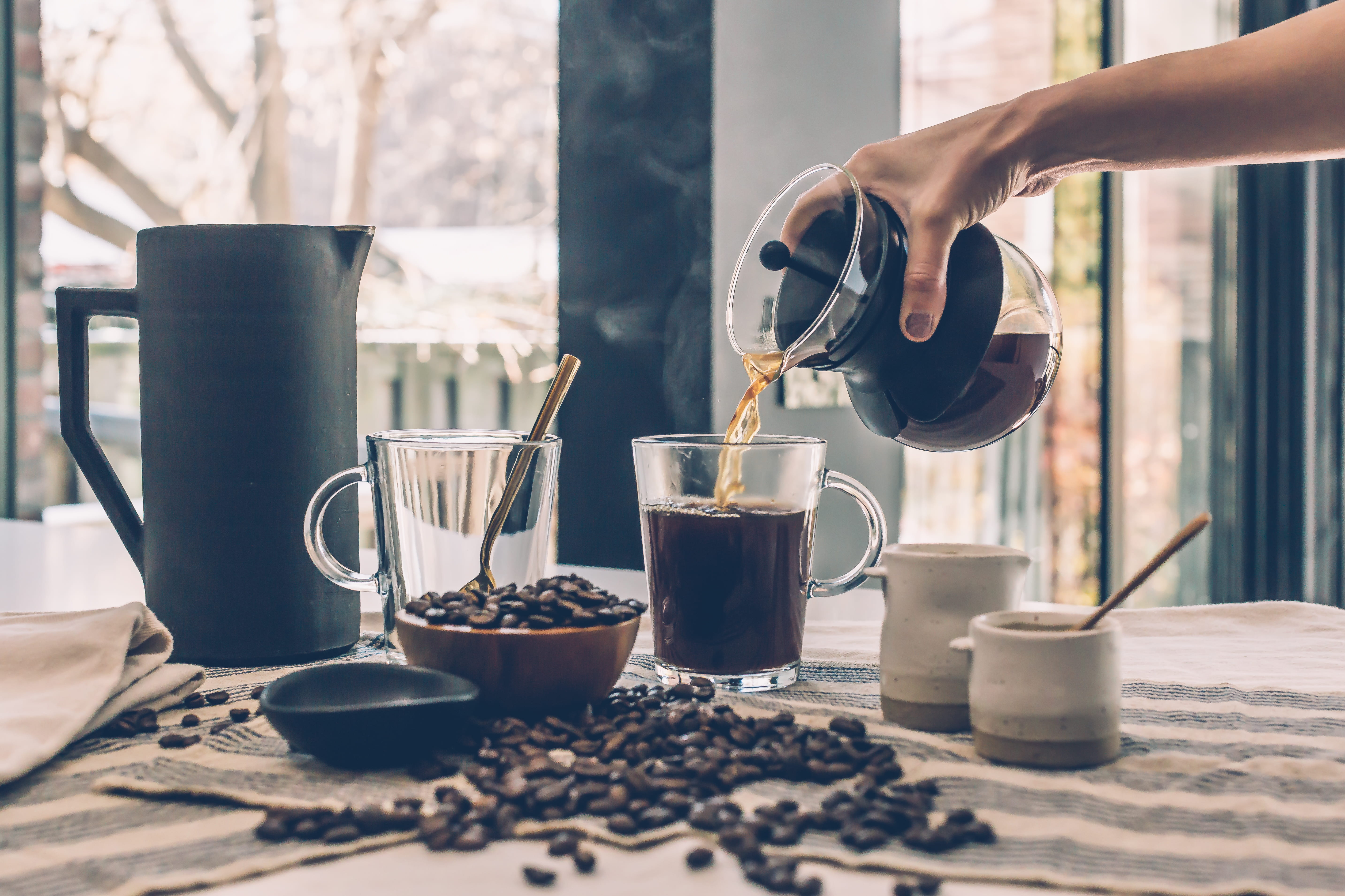 cappuccino, indoors, tableware, food and drink, furnitures, mug, refreshment, glasses, 5K, dawn, milk, brewed coffee, hand, hot, relaxation, breakfast, HD Wallpaper