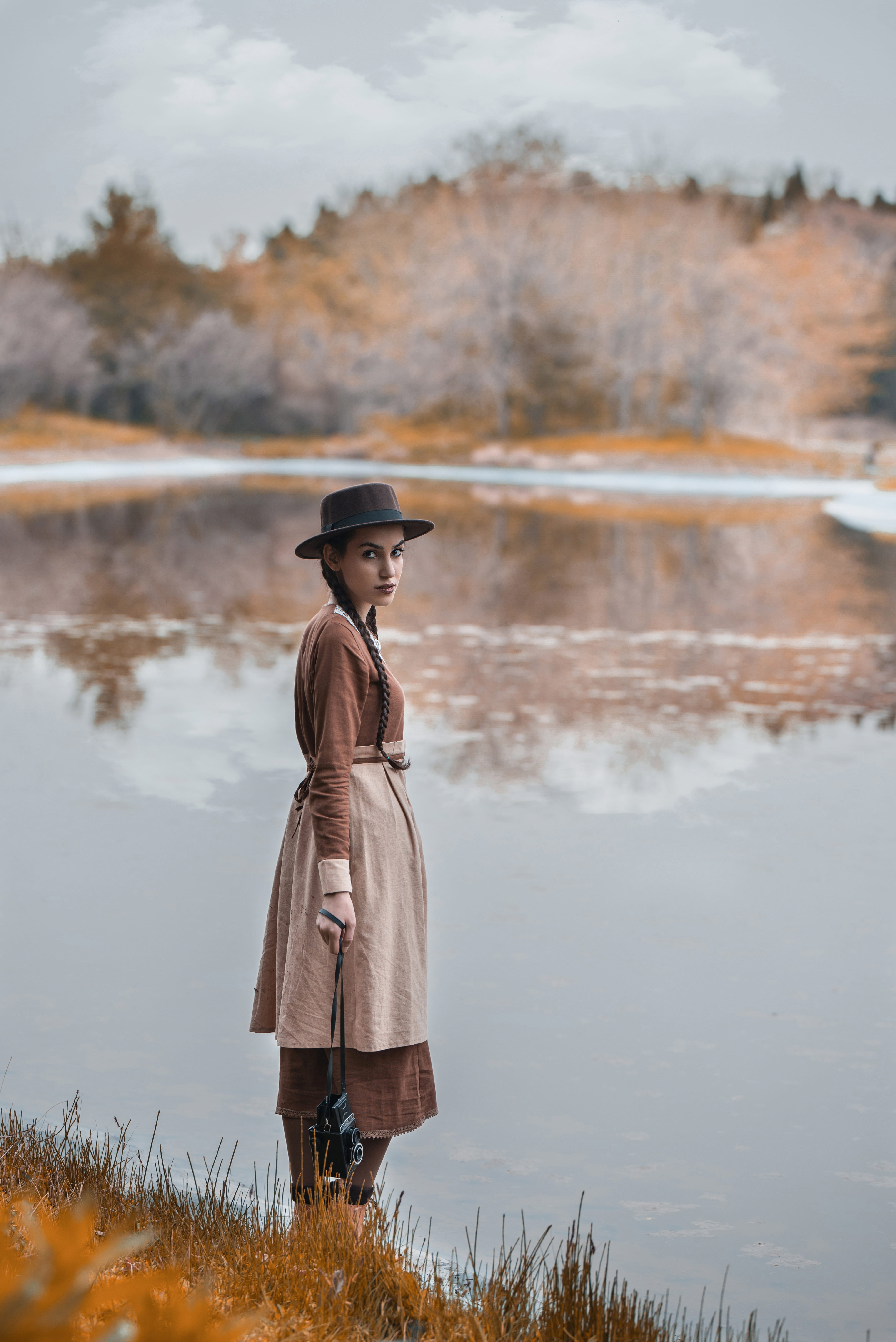 water, side view, lake, daytime, real people, standing, lifestyles, beauty in nature, scenics - nature, clothing, carrying, female, focus on foreground, Phone HD Wallpaper