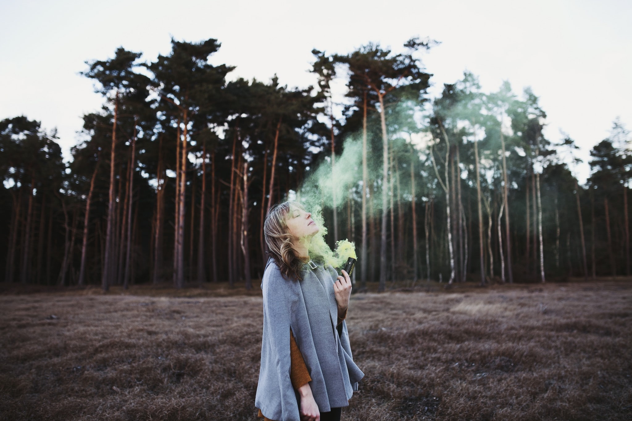 women outdoors, 1080P, colored smoke, hairstyle, day, field, woodland, one person, outdoors, land, ponchos, real people, leisure activity, women, closed eyes, HD Wallpaper