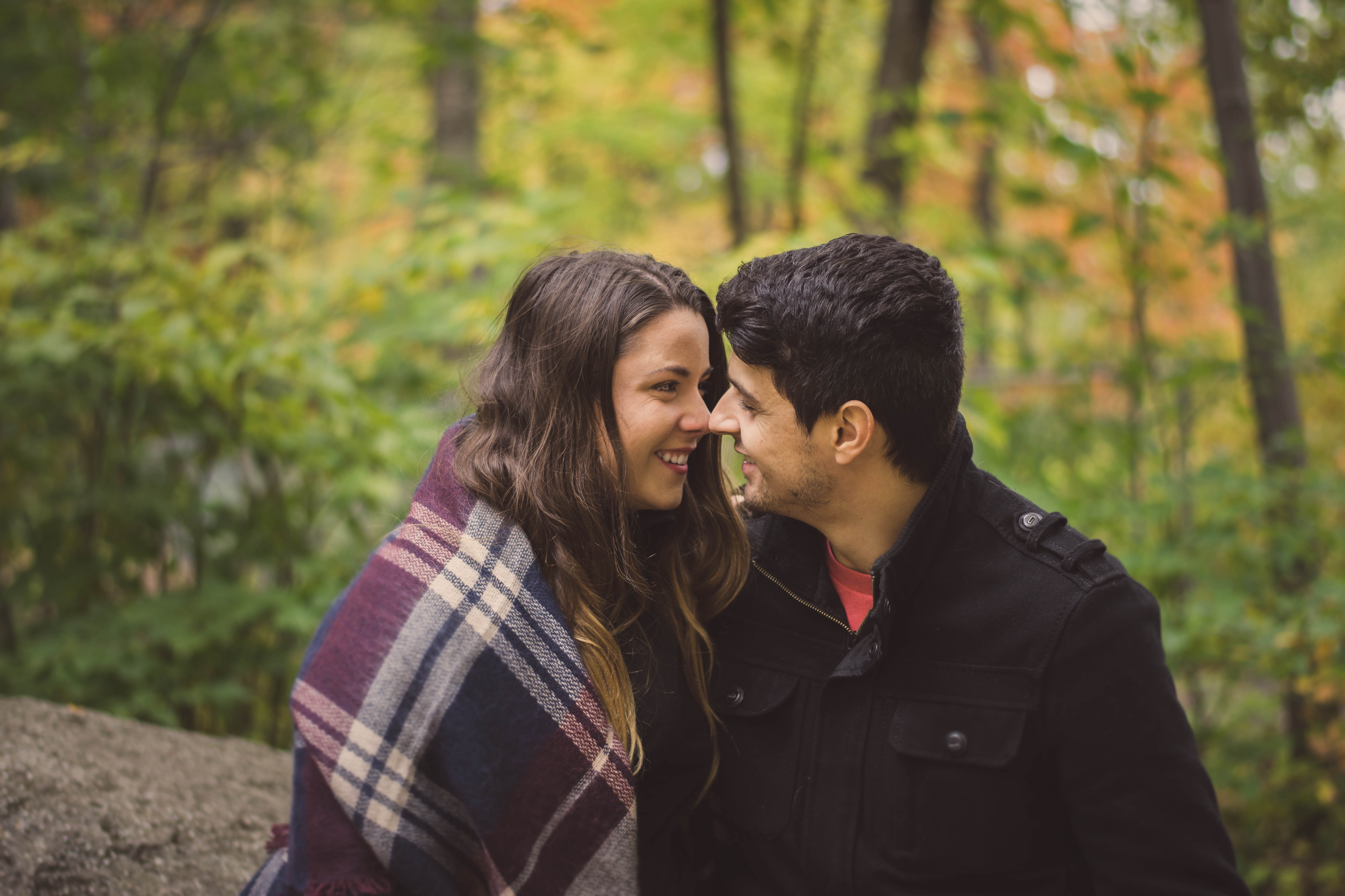 couple - relationship, apparel, facing, bonding, female, trees, poncho, human, face, daytime, pants, women, positive emotion, surrounded, young couple, HD Wallpaper