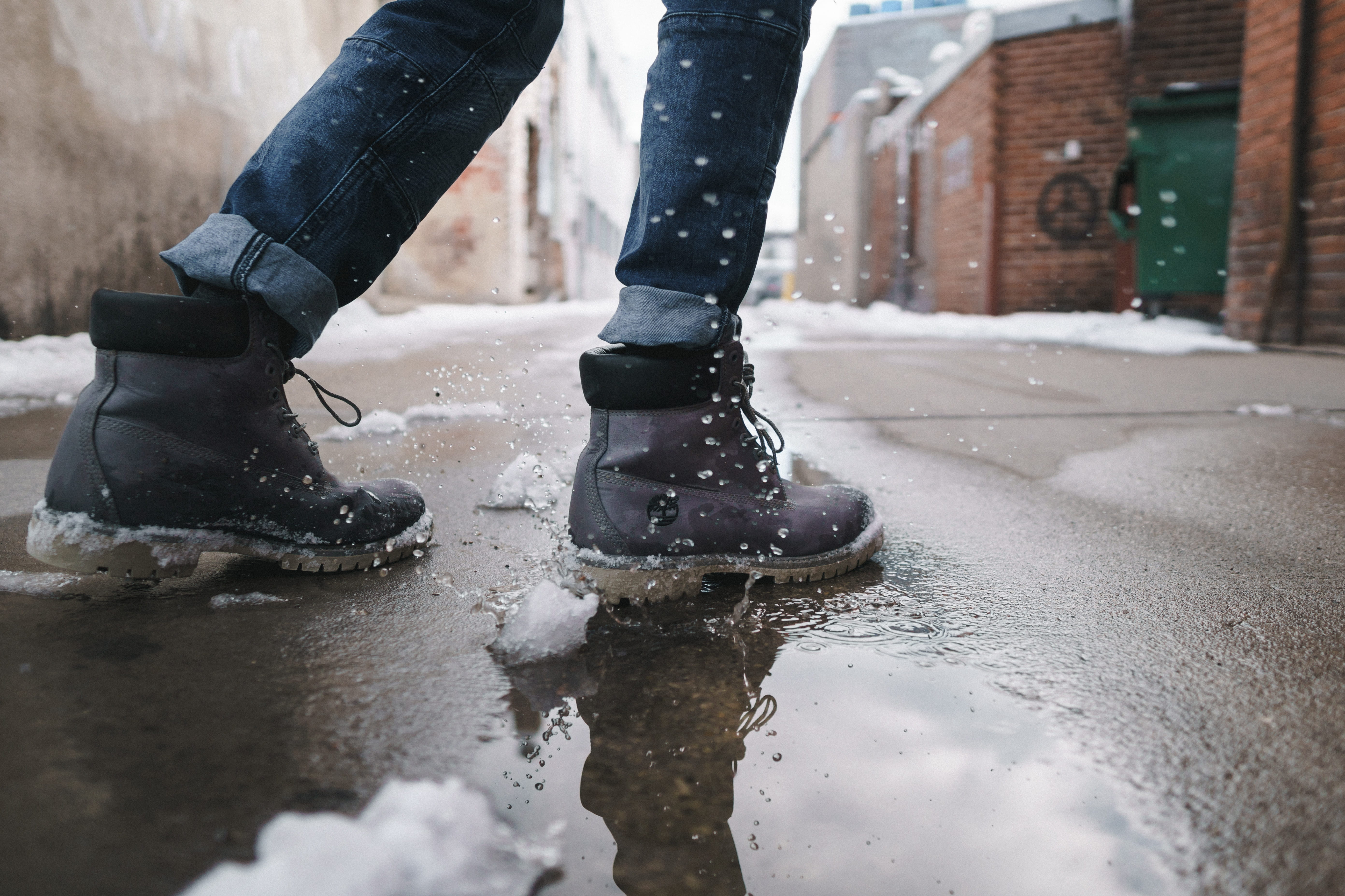 architecture, outdoors, body part, puddle, wearing, low section, cold temperature, leather, rubber boot, human body part, human limb, real people, walking, HD Wallpaper