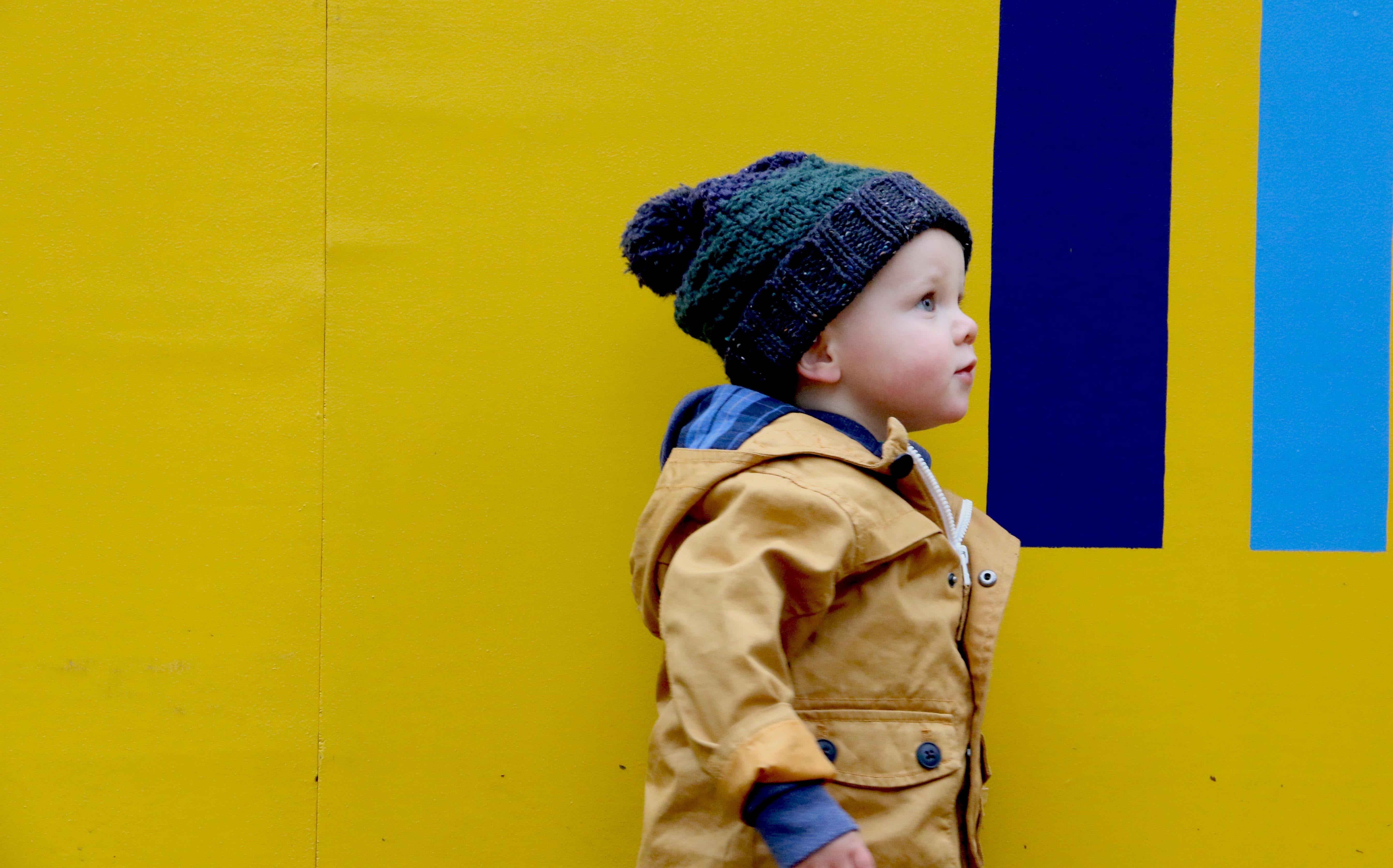 innocence, coat, side view, boys, casual clothing, outdoors, one person, 5K, childhood, clothing, bonnet, wall - building feature, people, looking, offspring, HD Wallpaper