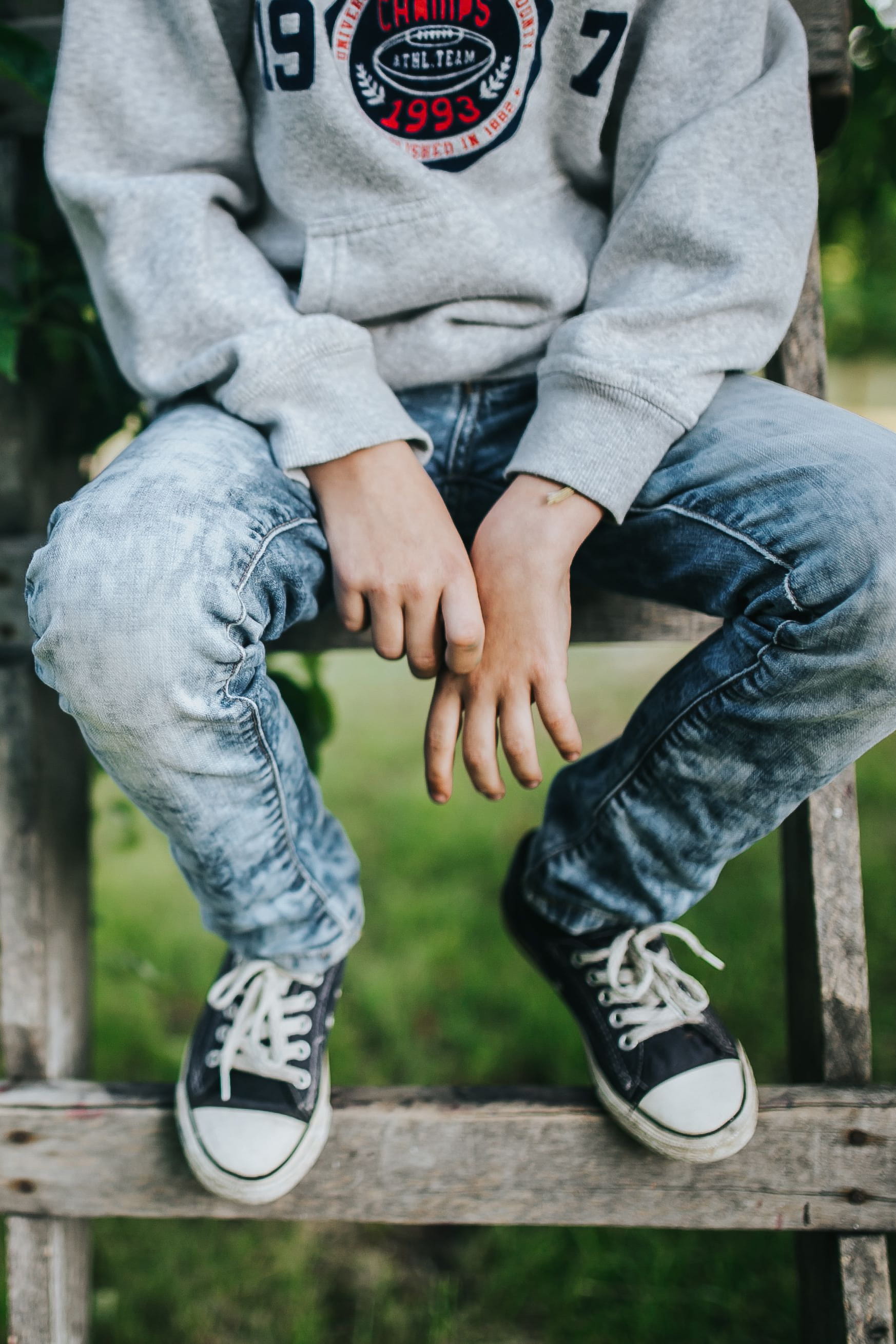 casual clothing, child, Young boy, male, childhood, focus on foreground, one Person, teenage, boys, young, jeans, garden, 2K, human body part, relaxation, Phone HD Wallpaper