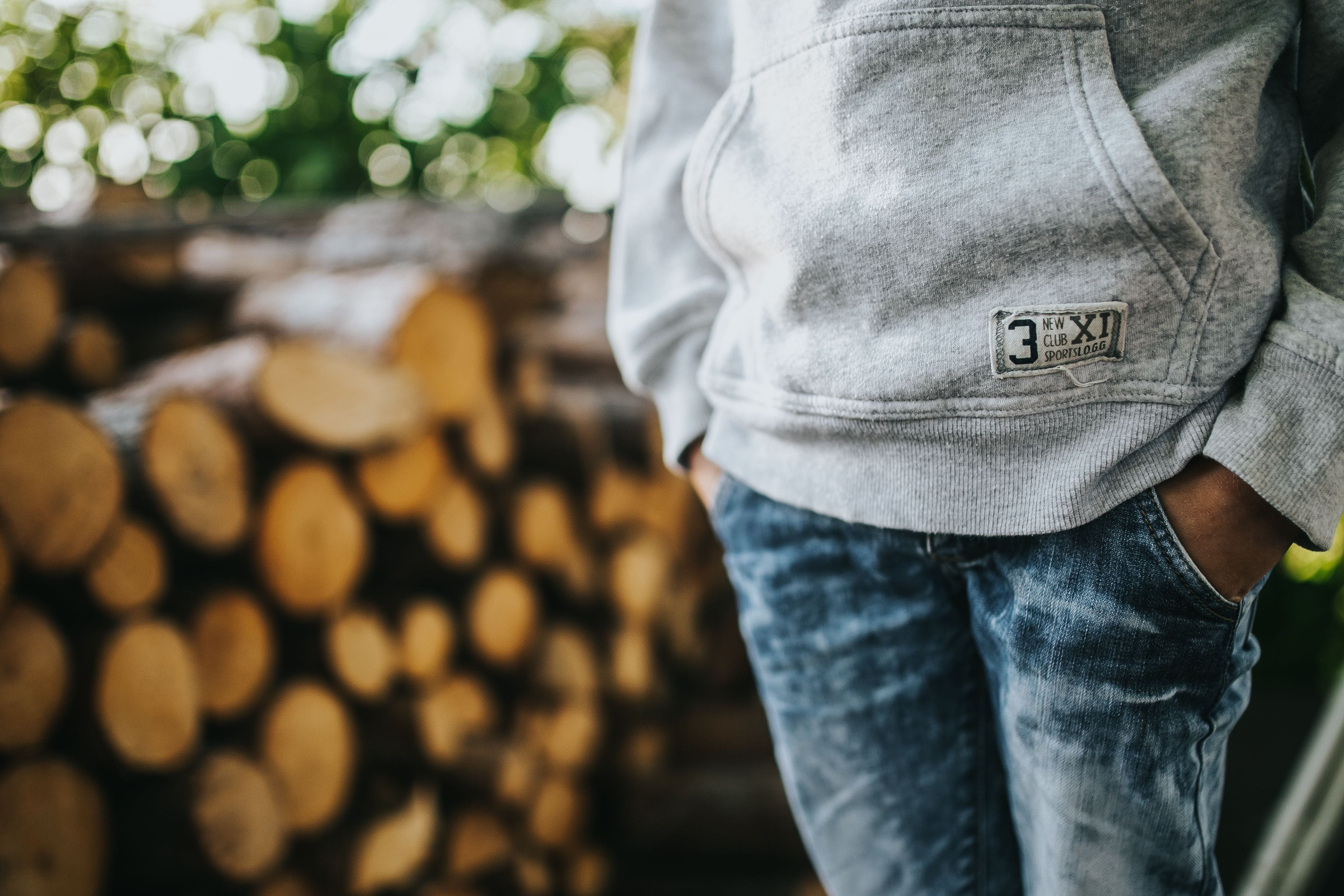 men, log, jeans, casual clothing, garden, wood - Material, standing, stack, young, adult, forest, teenage, abundance, one Person, large group of objects, HD Wallpaper