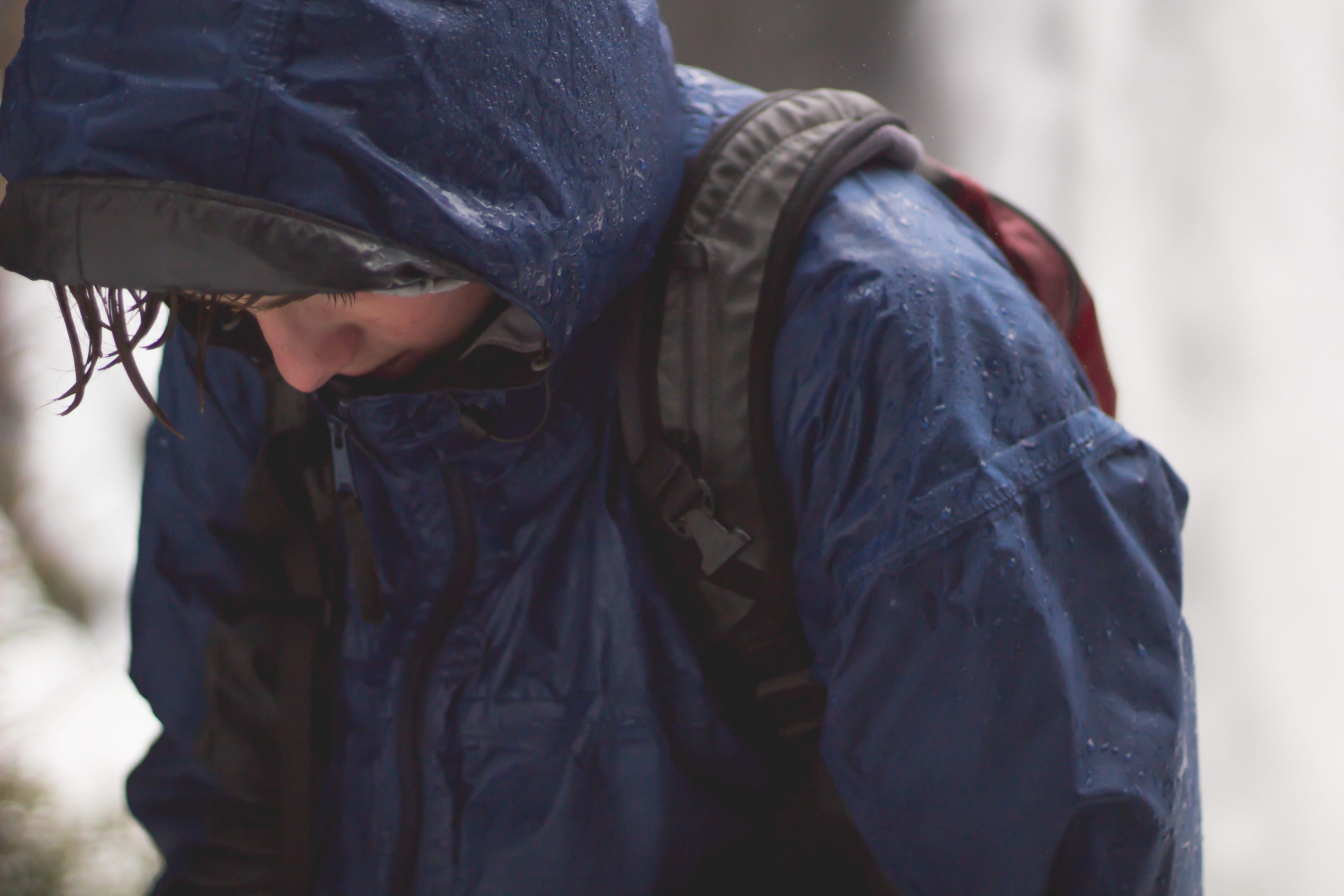 wearing, focus on foreground, wet, front view, raincoat, warm clothing, backpack, walking, jacket, winter, midsection, low, adult, casual clothing, snow, HD Wallpaper