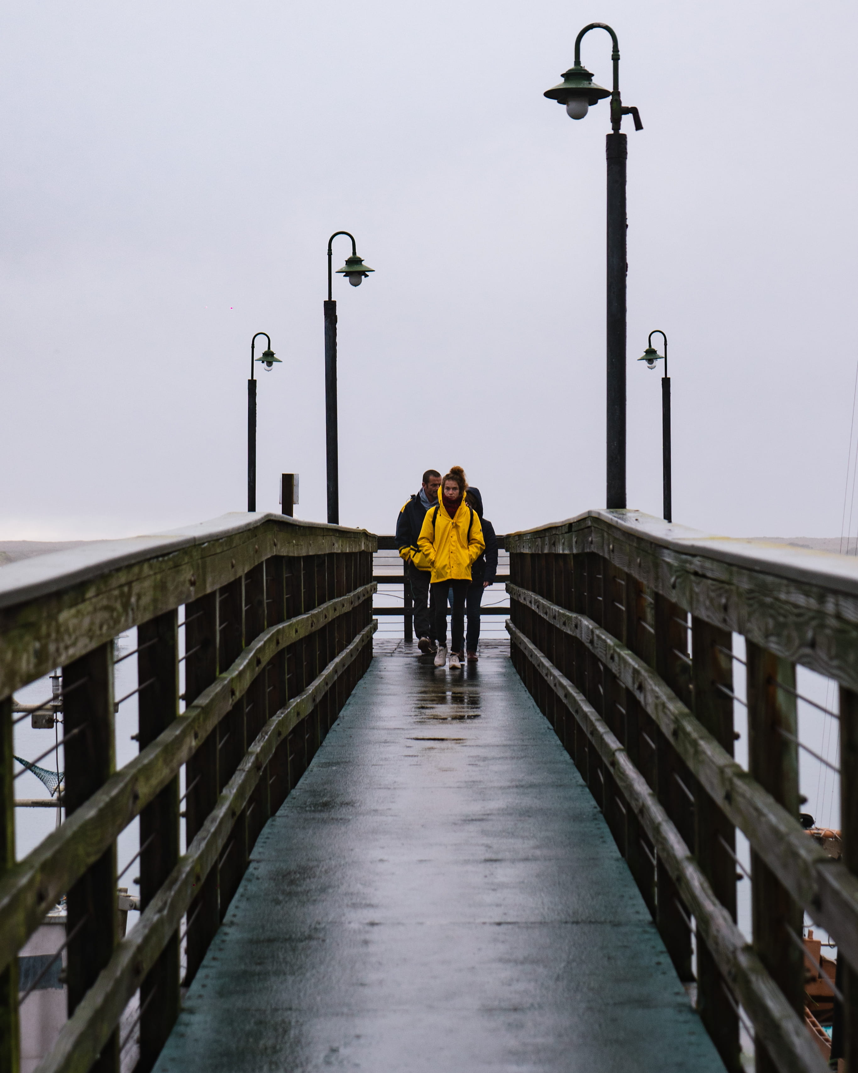 real people, raincoat, color, built structure, person, contrast, street, outdoors, moody, street light, architecture, the way forward, fog, apparel, men, Phone HD Wallpaper