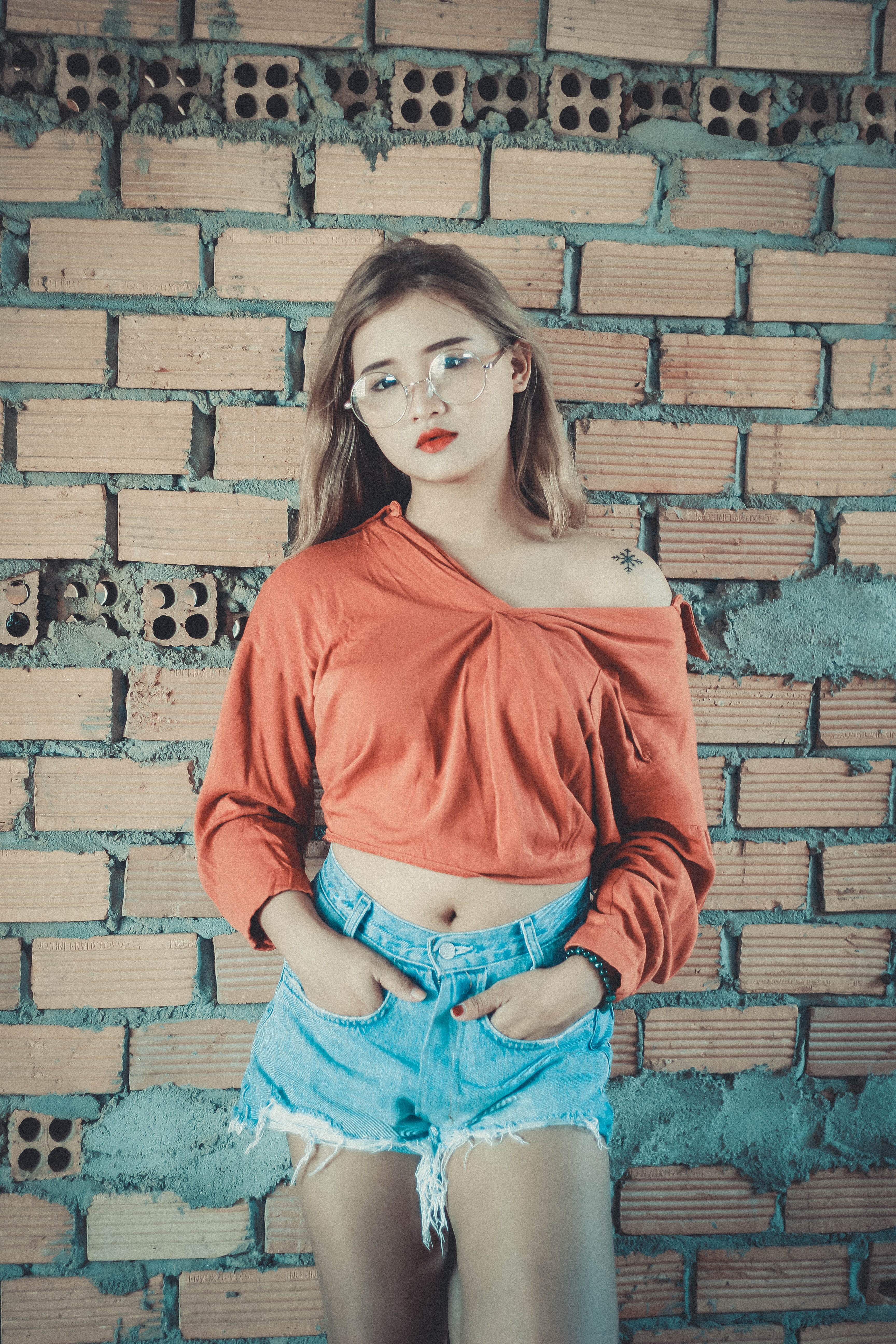 long, stone wall, fashionable, real people, model, red, lady, female, casual, hairstyle, women, fashion, beautiful, denim, style, young, front view, hair, Phone HD Wallpaper