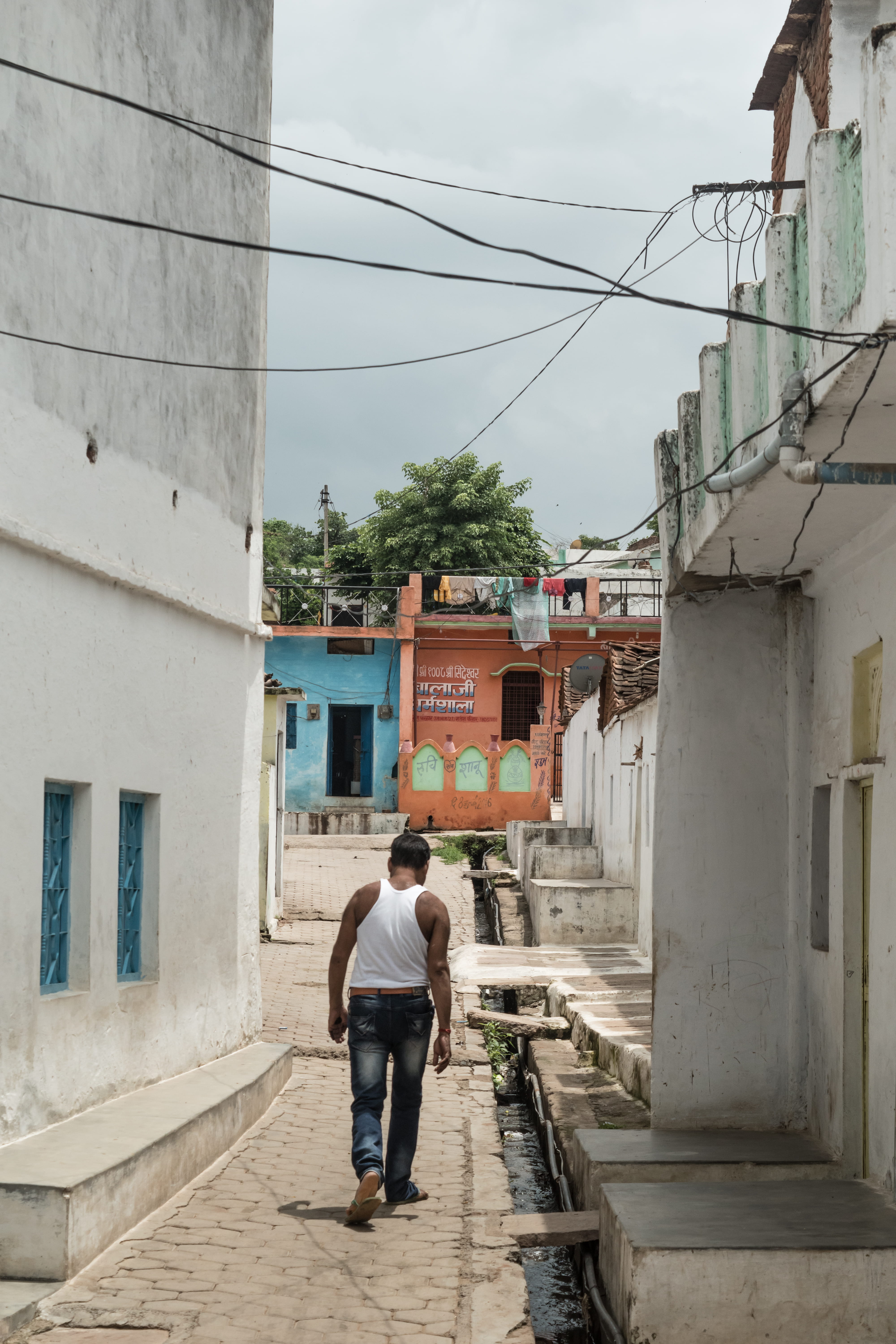 sky, building exterior, concrete, outdoor, narrow, rear view, nature, beside, one person, village, daytime, walking, pathway, residential district, man, Phone HD Wallpaper