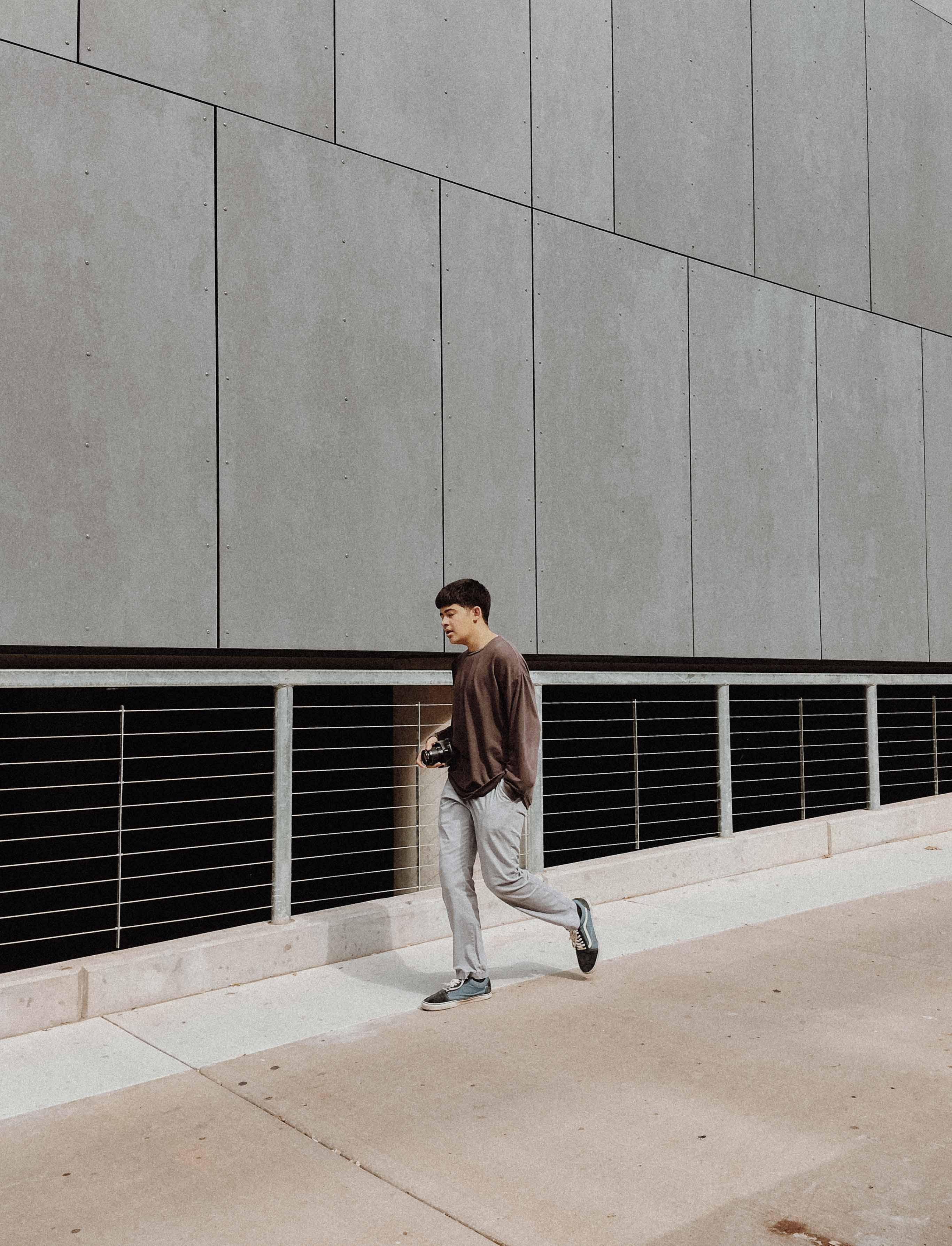 full length, architecture, leisure activity, young men, casual clothing, walking, sunlight, front view, real people, building, men, shirt, pavement, teenager, Phone HD Wallpaper