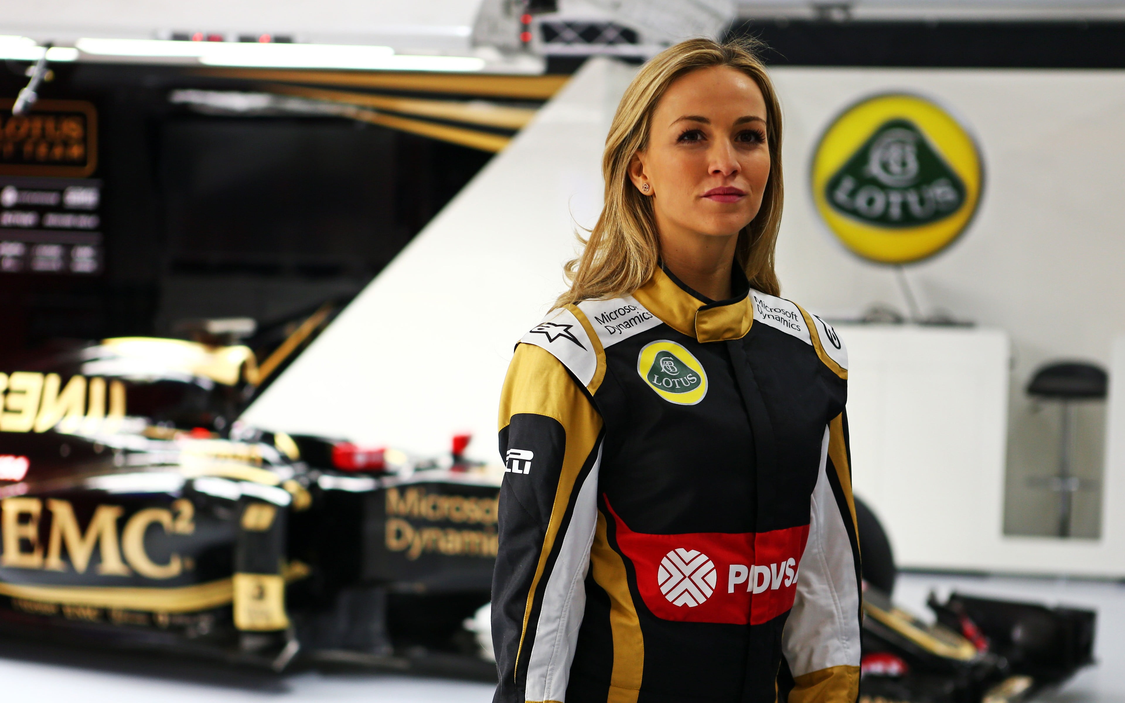 clothing, lifestyles, 4K, waist up, transportation, real people, women, Formula 1, focus on foreground, young adult, beauty, beautiful woman, Lotus, uniform, HD Wallpaper