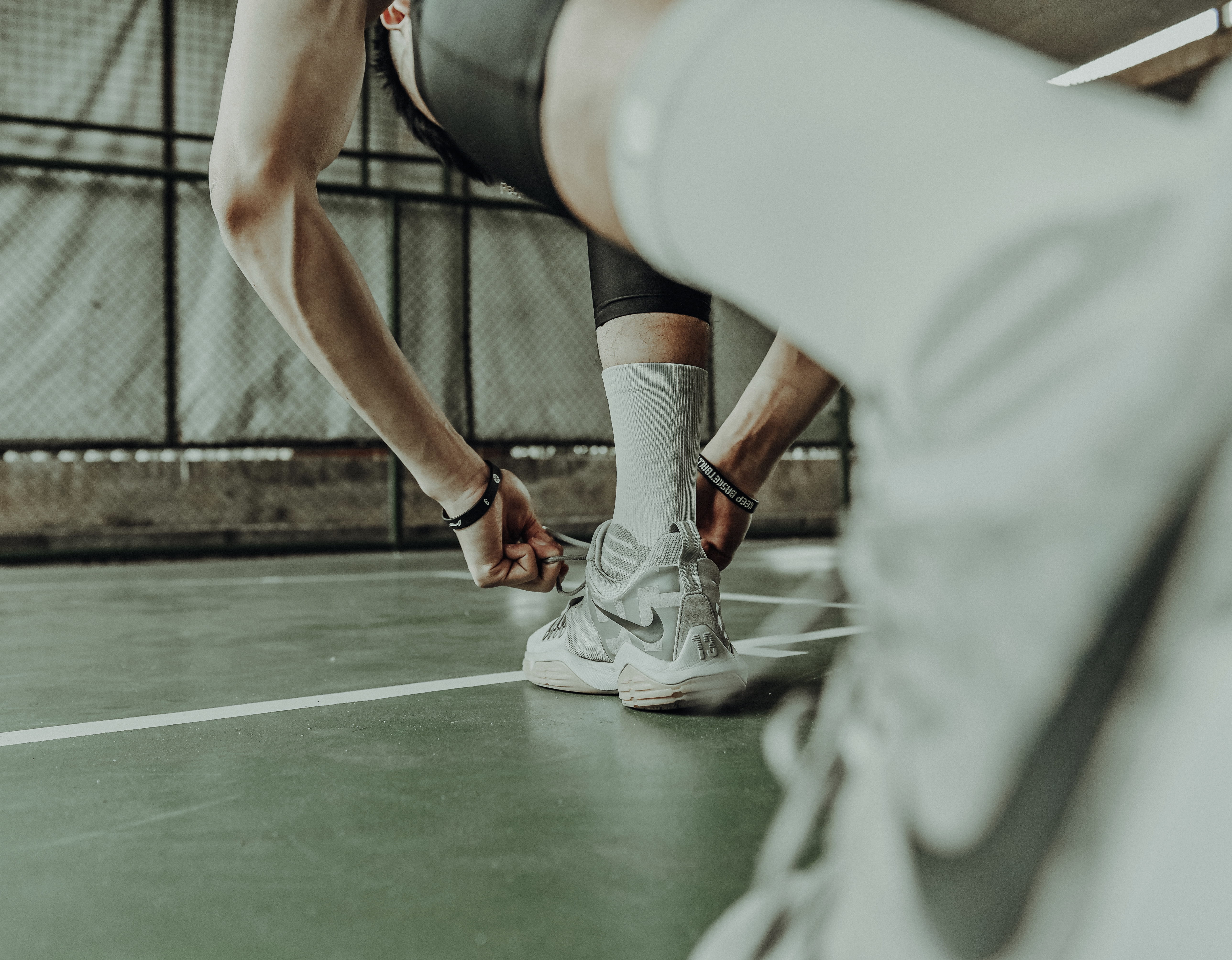 people, clogs, shoe, sneakers, ankle, two people, human, wearing, nike, shorts, young adult, sphere, running shoe, white, selective focus, flagstone, human limb, HD Wallpaper