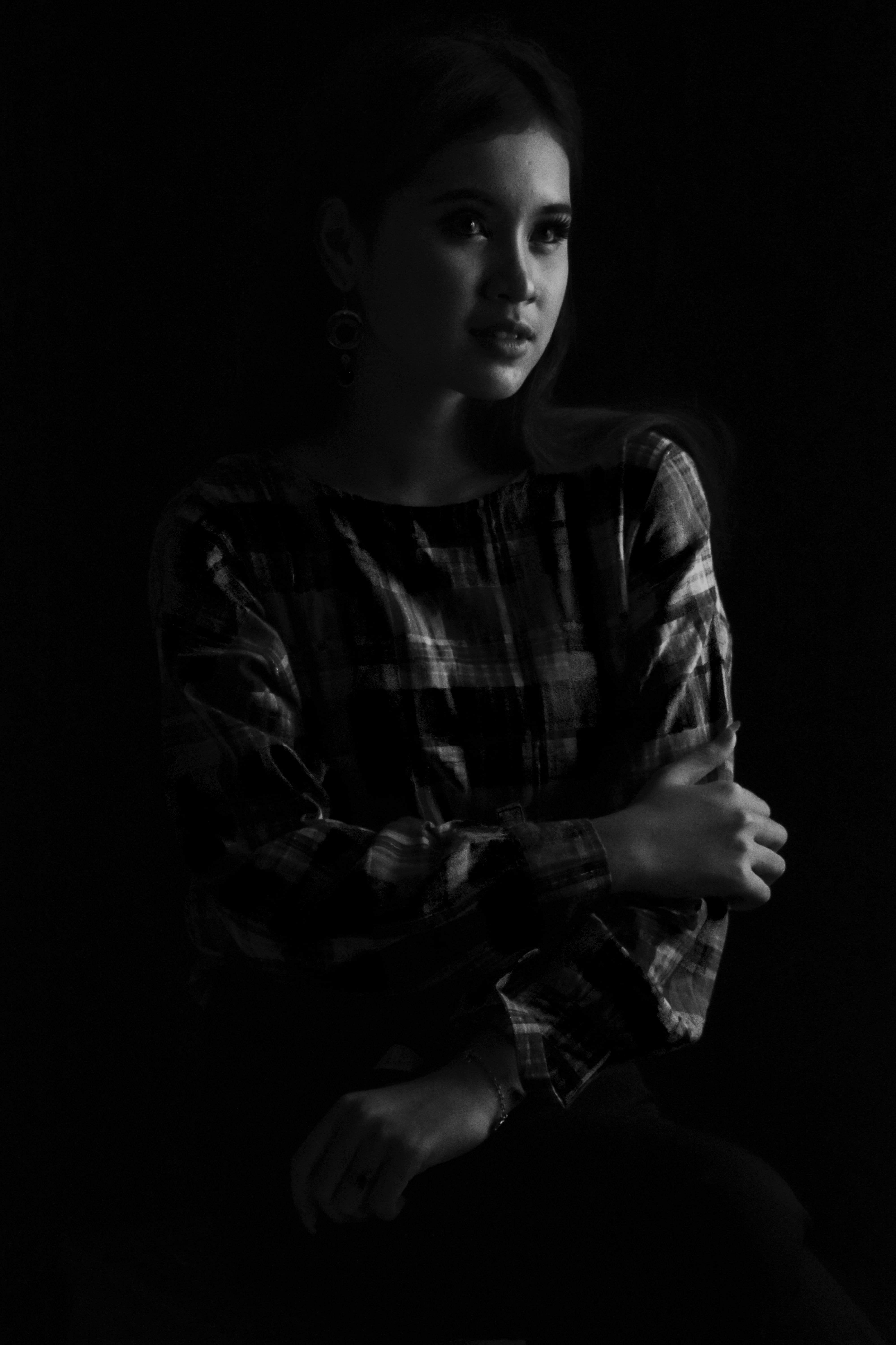 women, photography, studio shot, contemplation, black background, front view, female, dark, one person, 5K, long sleeve, clothing, sitting, apparel, potrait, Phone HD Wallpaper