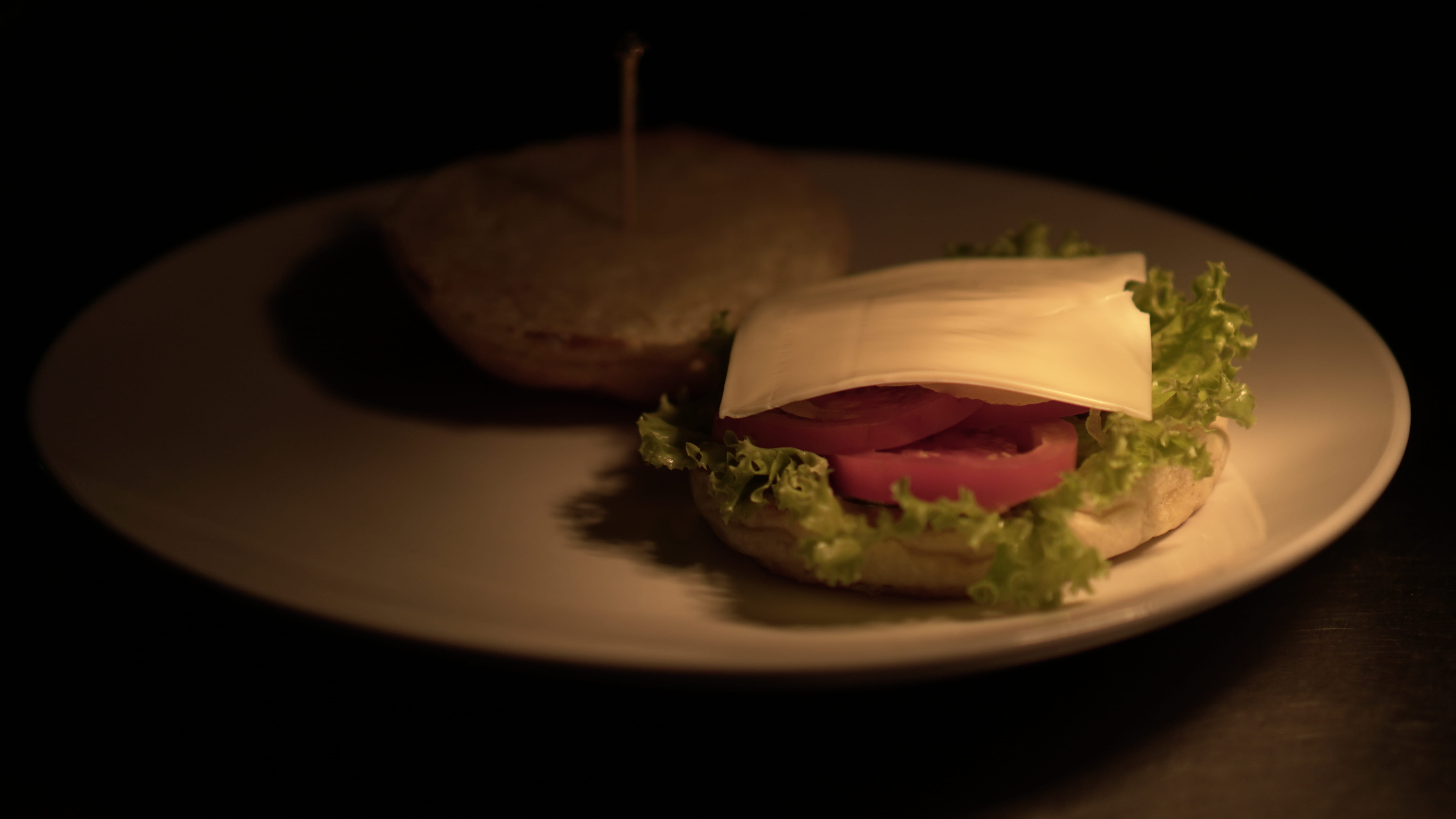 hamburger, close-up, saucer, bagel, seasoning, sweets, cheeseburger, black background, sandwich, kitchen, food, lowlight, lettuce, take out food, bread, HD Wallpaper