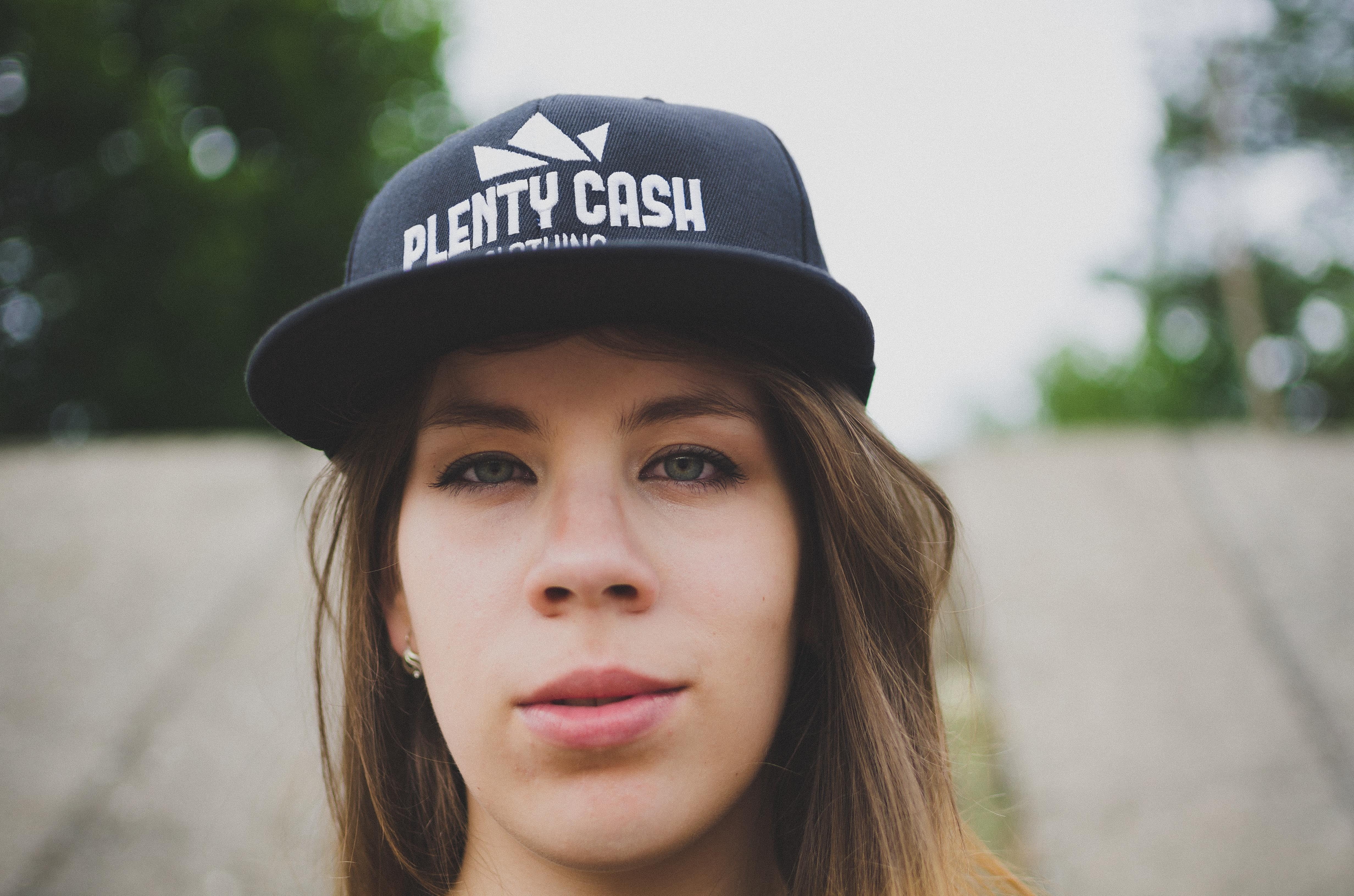 outdoors, headshot, females, contemplation, looking at camera, brown hair, street wear, snapback, child, portrait, cap, clothing, teenage girls, front view, HD Wallpaper