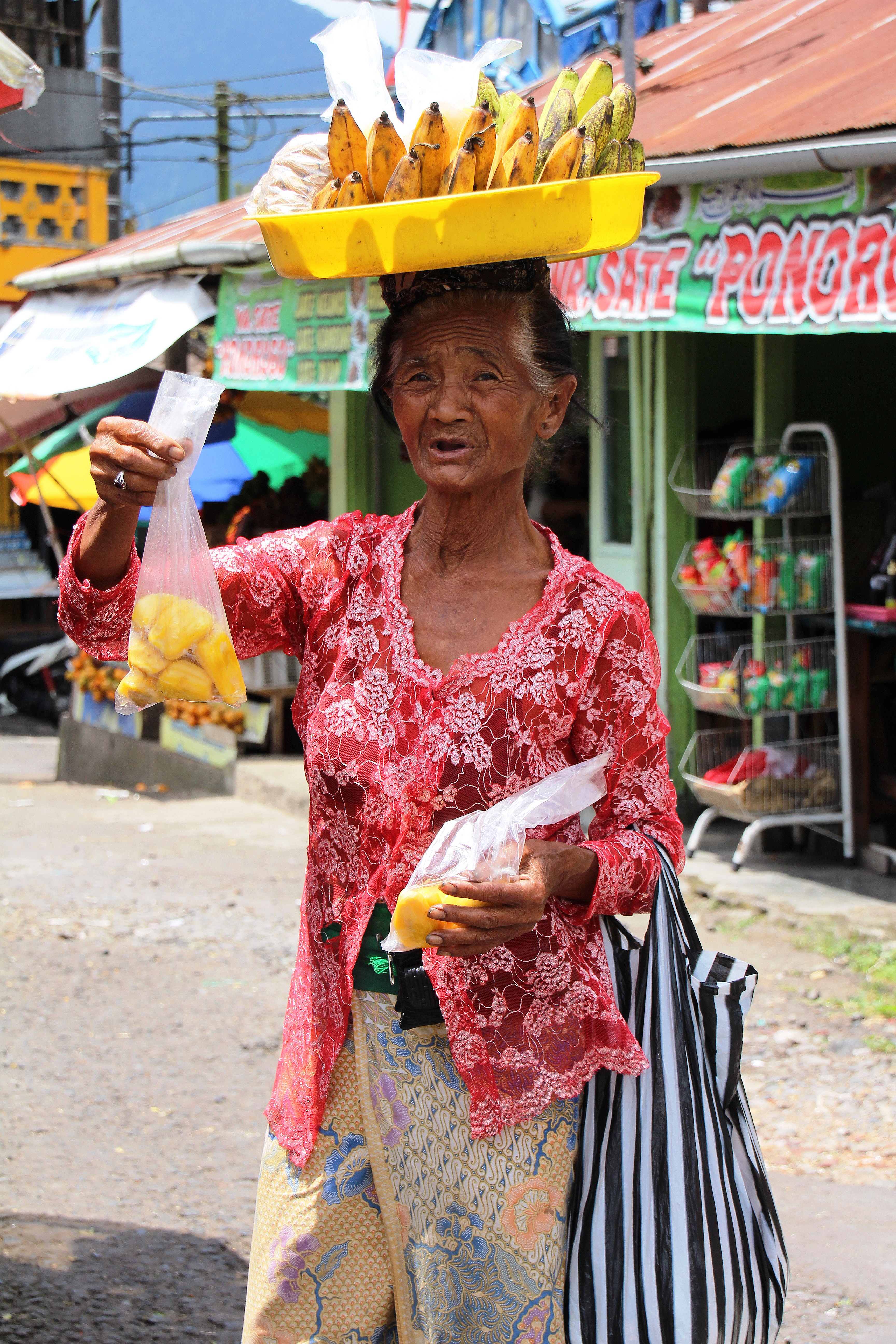 front view, senior adult, street sales, portrait, multi colored, bali, real people, women, 5K, standing, adult, lifestyles, outdoors, hairstyle, emotion, Phone HD Wallpaper