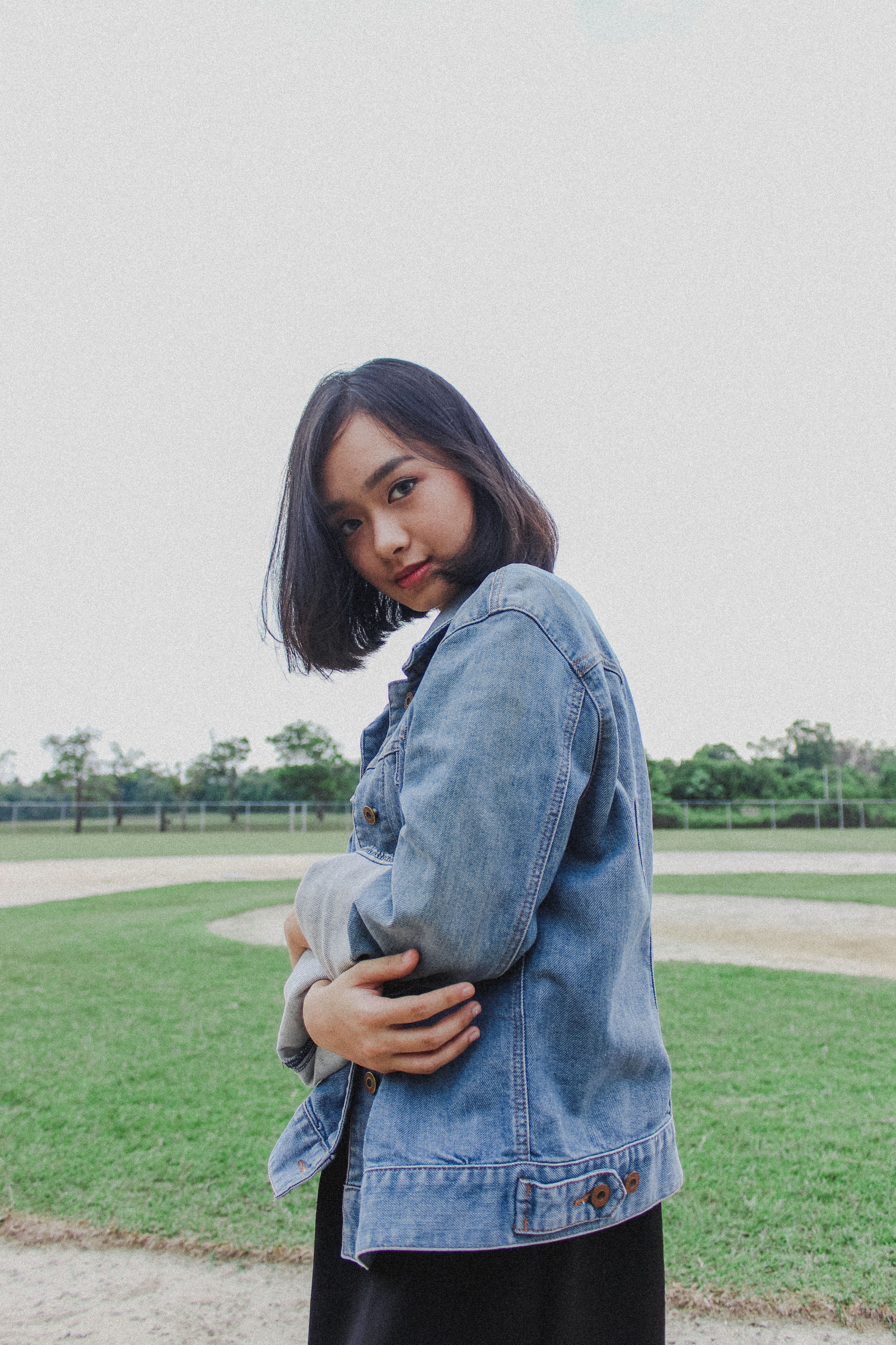 field, looking at camera, sky, girl, hair, real people, woman, young women, copy space, lifestyles, standing, 5K, indonesia, one person, long hair, portrait, Phone HD Wallpaper