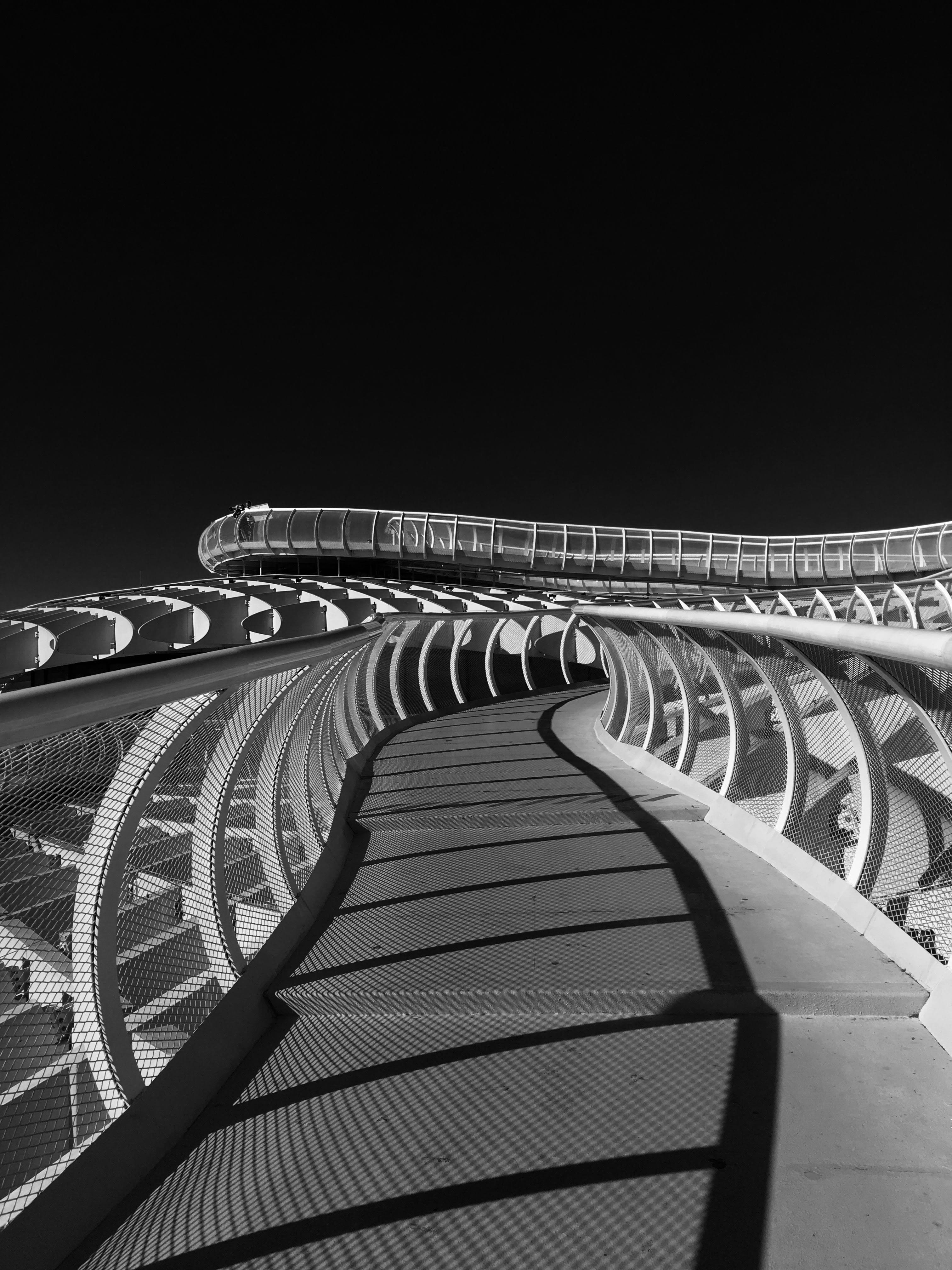 contrast colour, crossing bridge, crossing, bridge - Man Made Structure, curve, black sky, vanishing Point, outdoors, modern, architecture, sevilla, grayscale, Phone HD Wallpaper