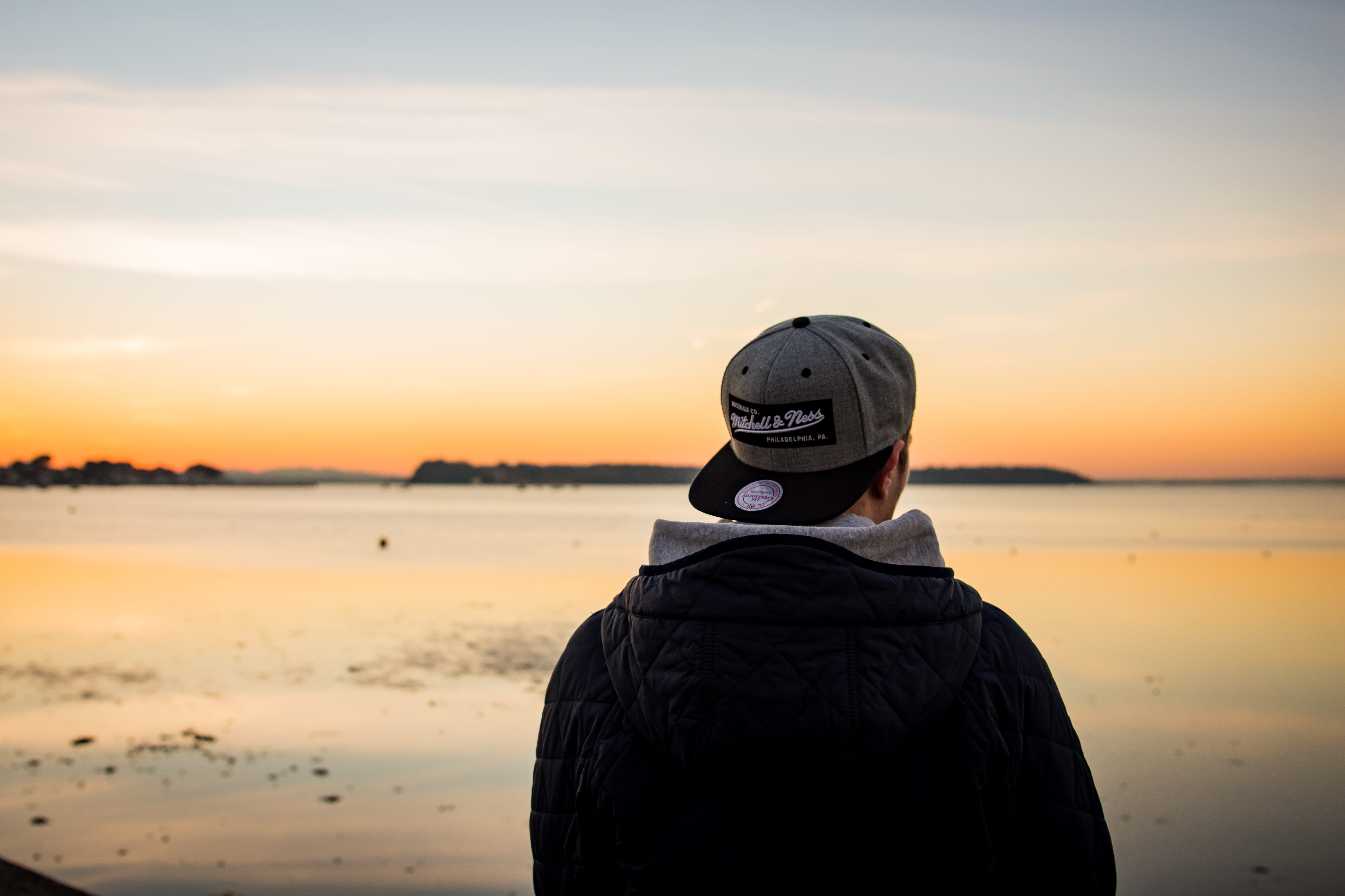 nature, sunset, land, body, brim, lifestyles, jacket, beach, hood, water, beauty in nature, sky, black, near, sea, hat, behind, real people, warm clothing, HD Wallpaper