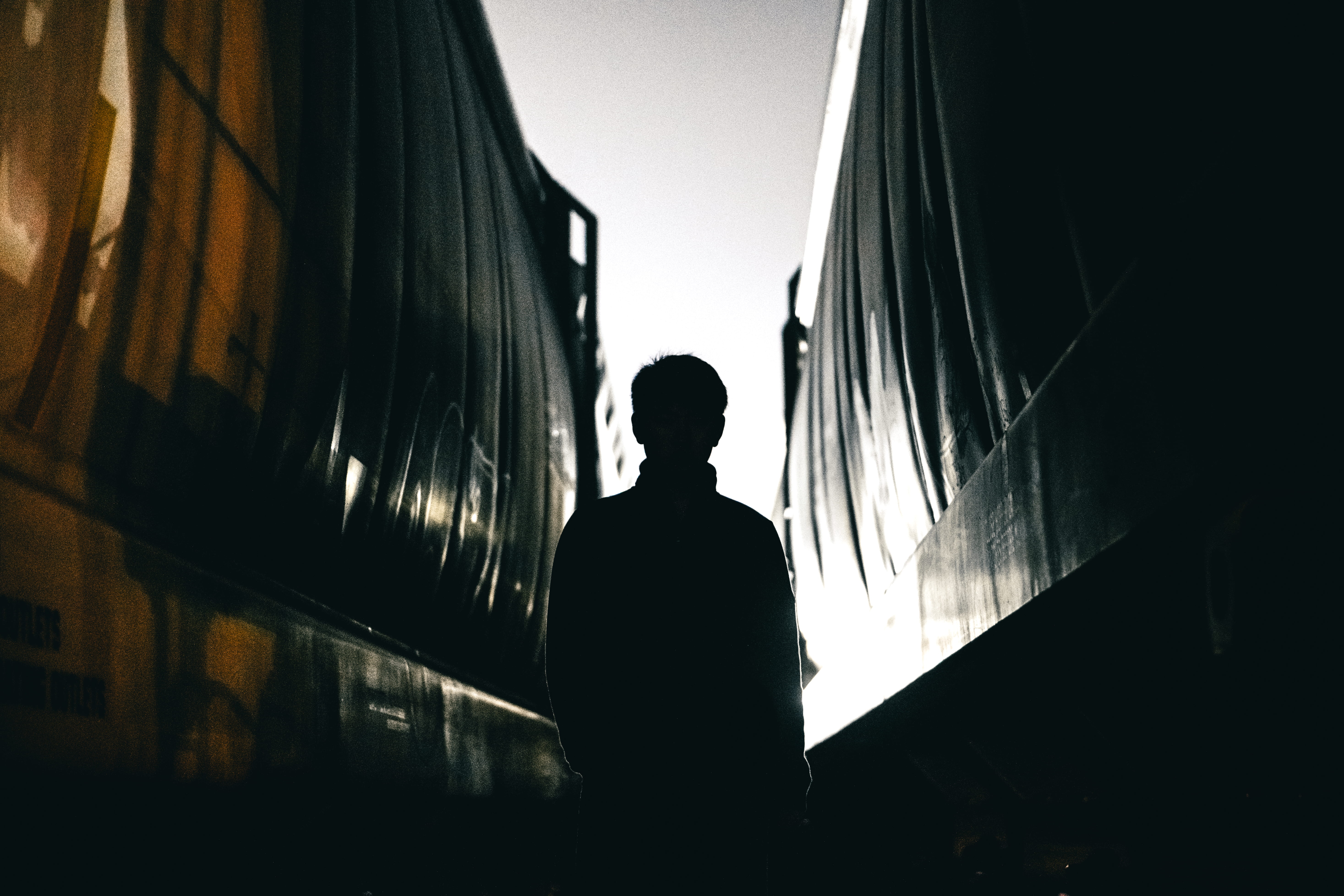 night, architecture, building, person, teen, back, light at the end of the tunnel, gap, 5K, orange, between trains, built structure, waiting, man, depression - sadness, HD Wallpaper