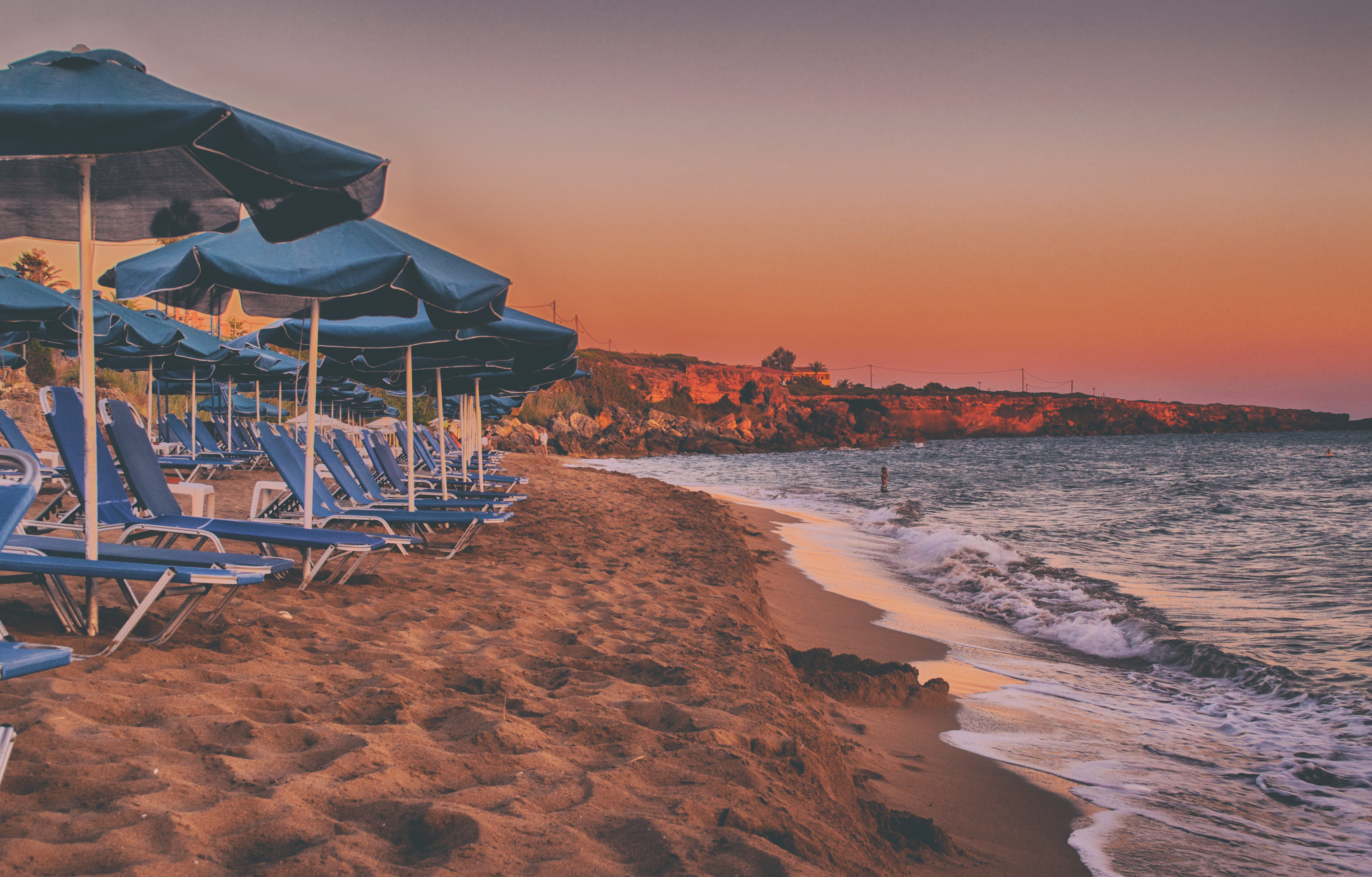 ocean, seashore, seaside, cliff coast, coastline, scenic, coast, land, blue, outdoor, waves, tranquility, idyllic, house, sunset, umbrellas, sky, no people, HD Wallpaper