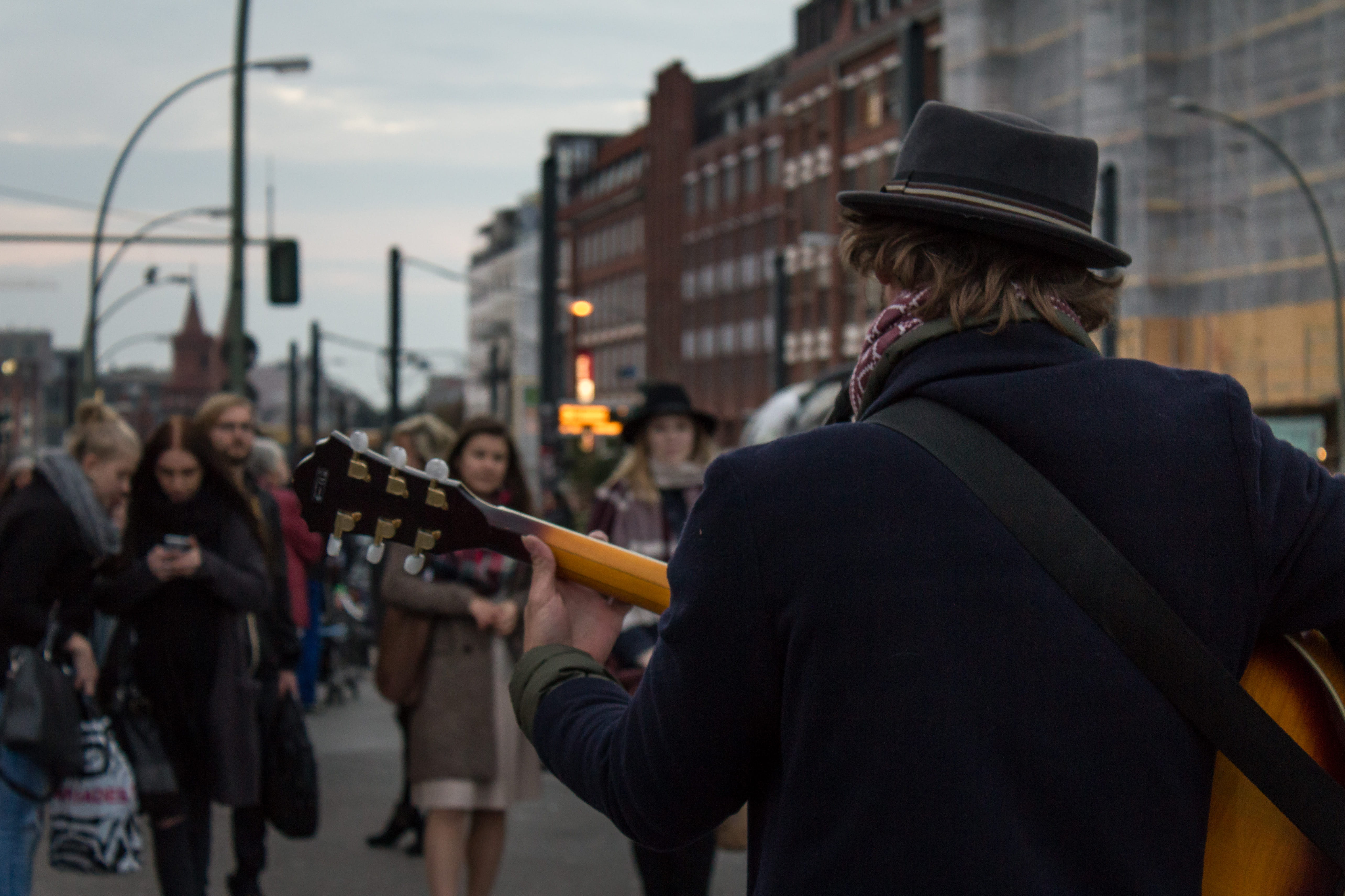 city life, band, rear view, playing, musical instrument, waist up, openair, adult, clothing, sound, concert, architecture, city, hat, focus on foreground, HD Wallpaper