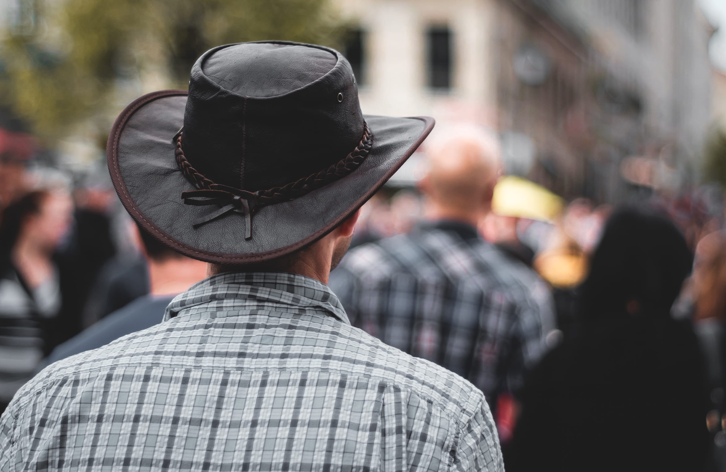 rear view, standing, walking, celebration, men, hat, focus on foreground, city, clothing, day, wearing, adult, cowboy, crowd, portrait, outdoors, from behind, HD Wallpaper