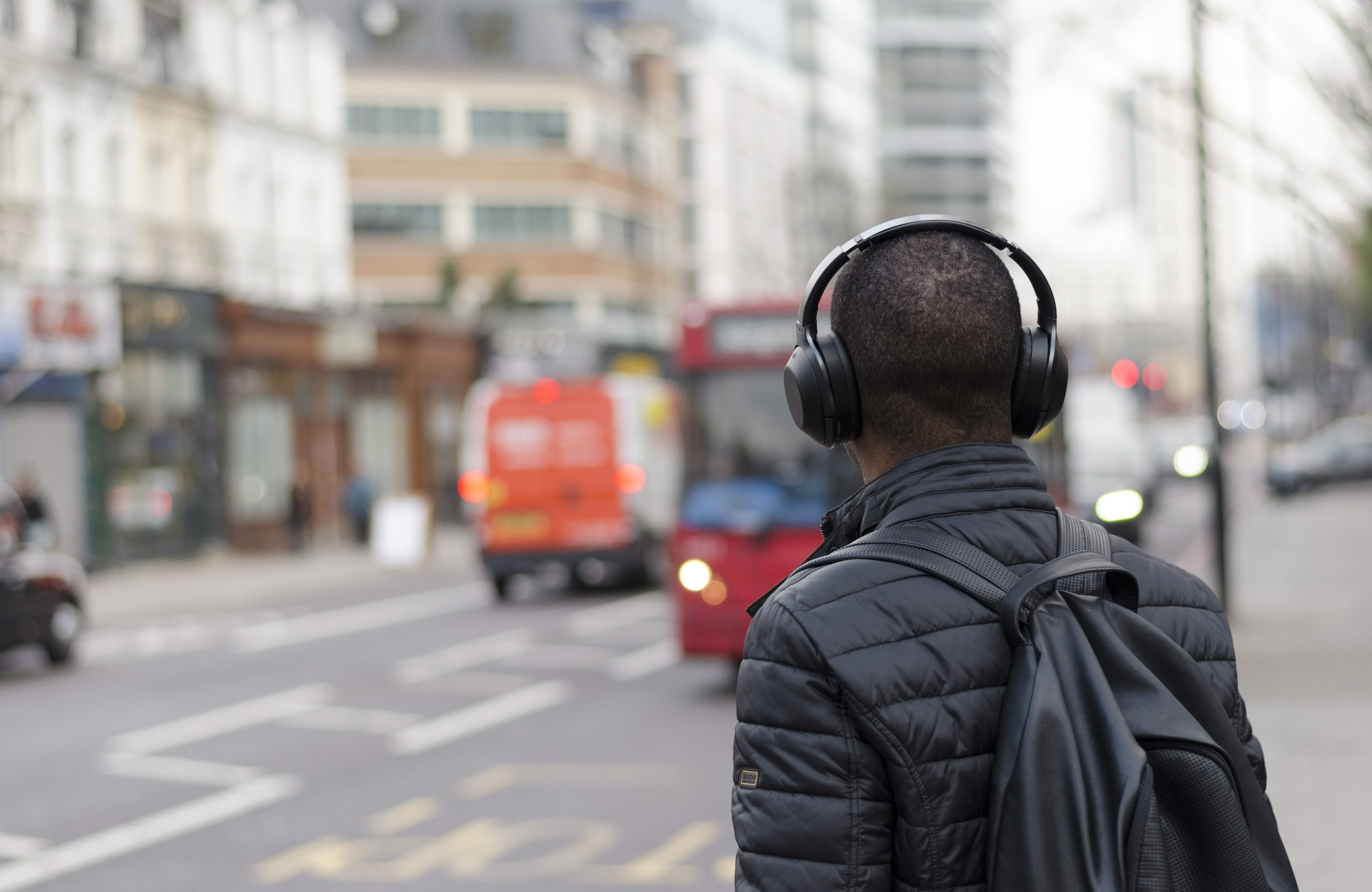 wearing, back, headphones, man, 4K, quilted, black, rear view, traffic, clothing, real people, standing, built structure, focus, day, focus on foreground, HD Wallpaper