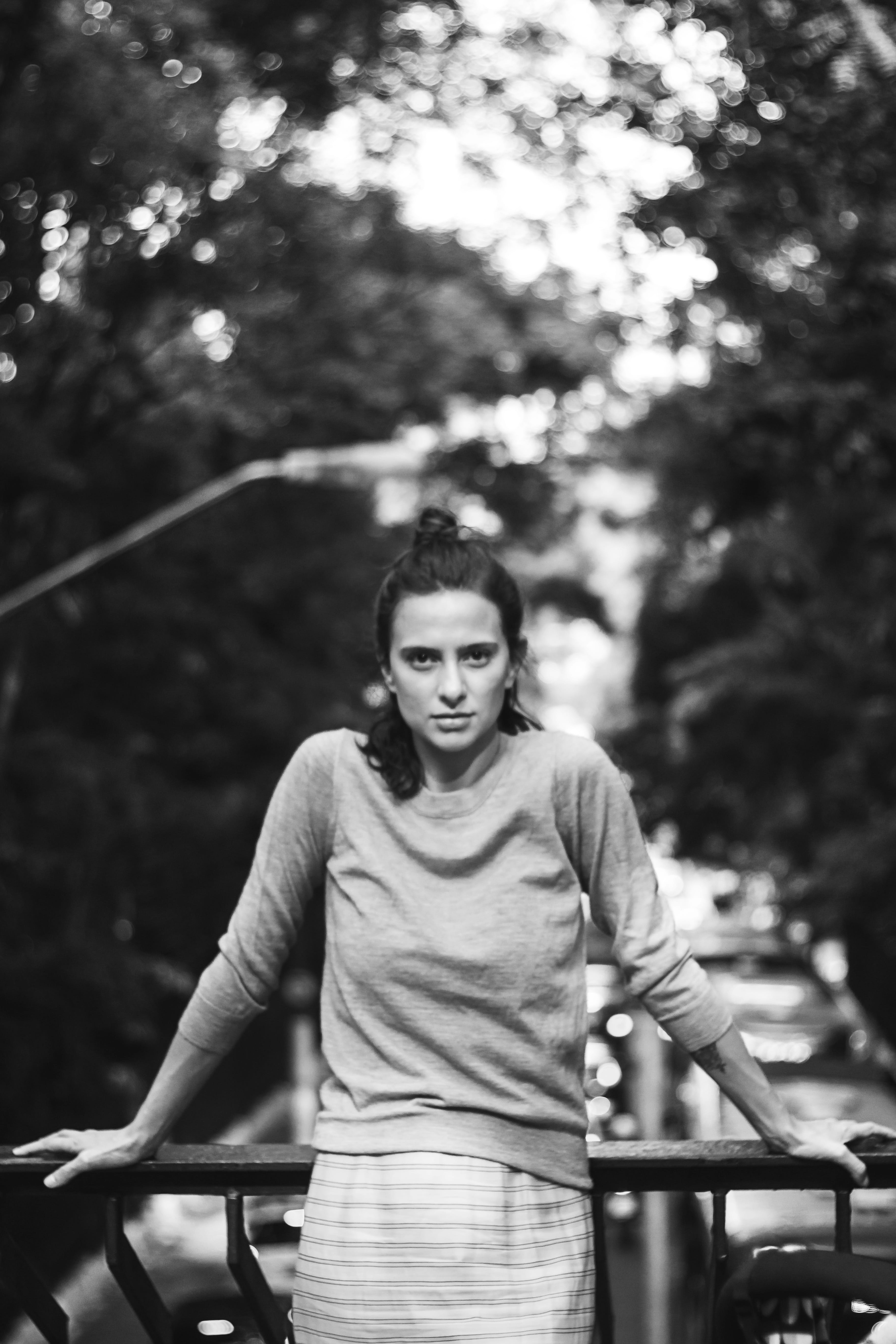 blurred background, hairstyle, tree, front view, 5K, facial expression, looking at camera, young adult, casual, black and white, attractive, female, youth, Phone HD Wallpaper