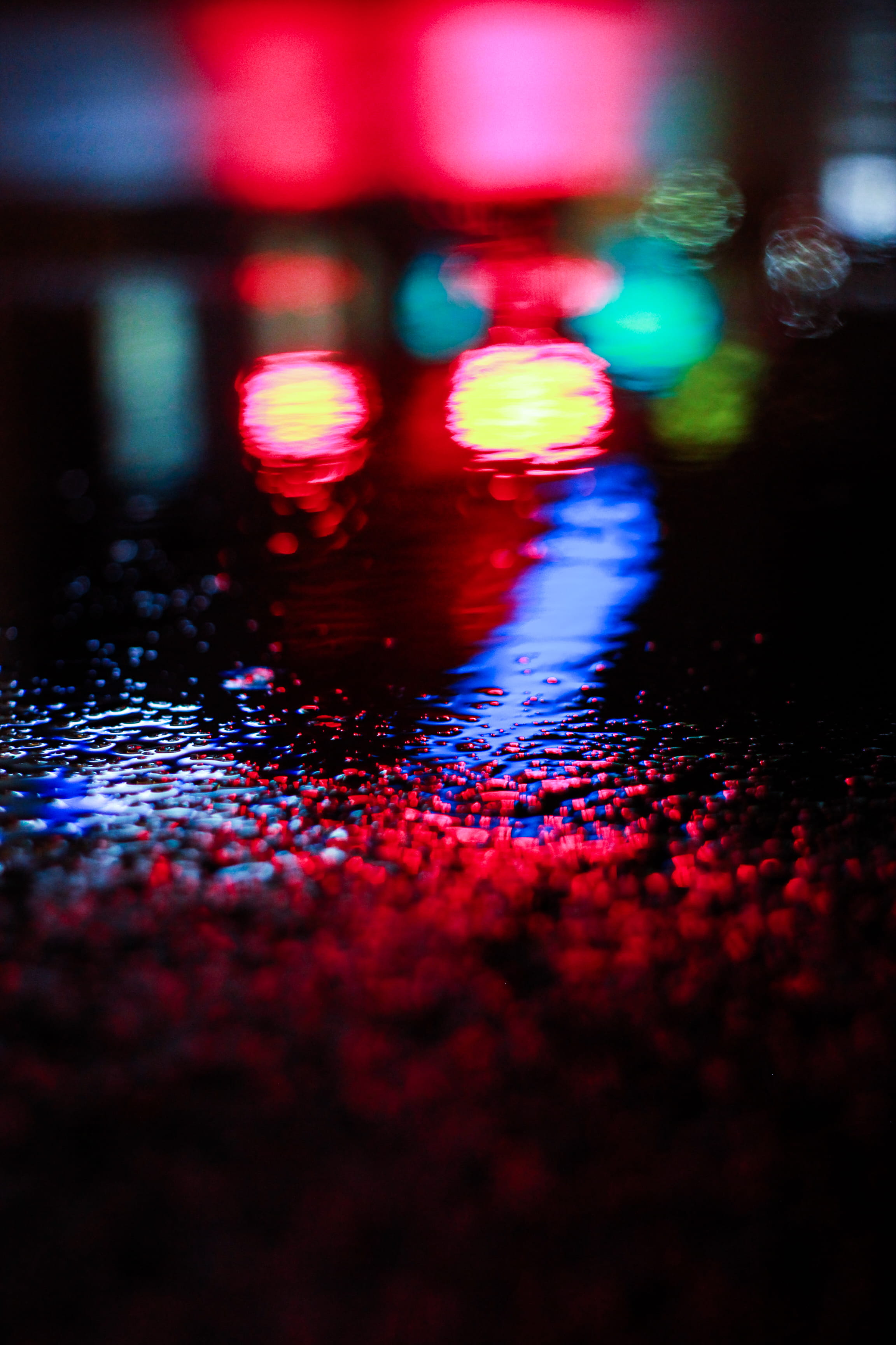 surface level, motion, multicolored, indoors, close-up, reflection, red, 2K, wet, no people, illuminated, textured, backgrounds, light, multi colored, Phone HD Wallpaper
