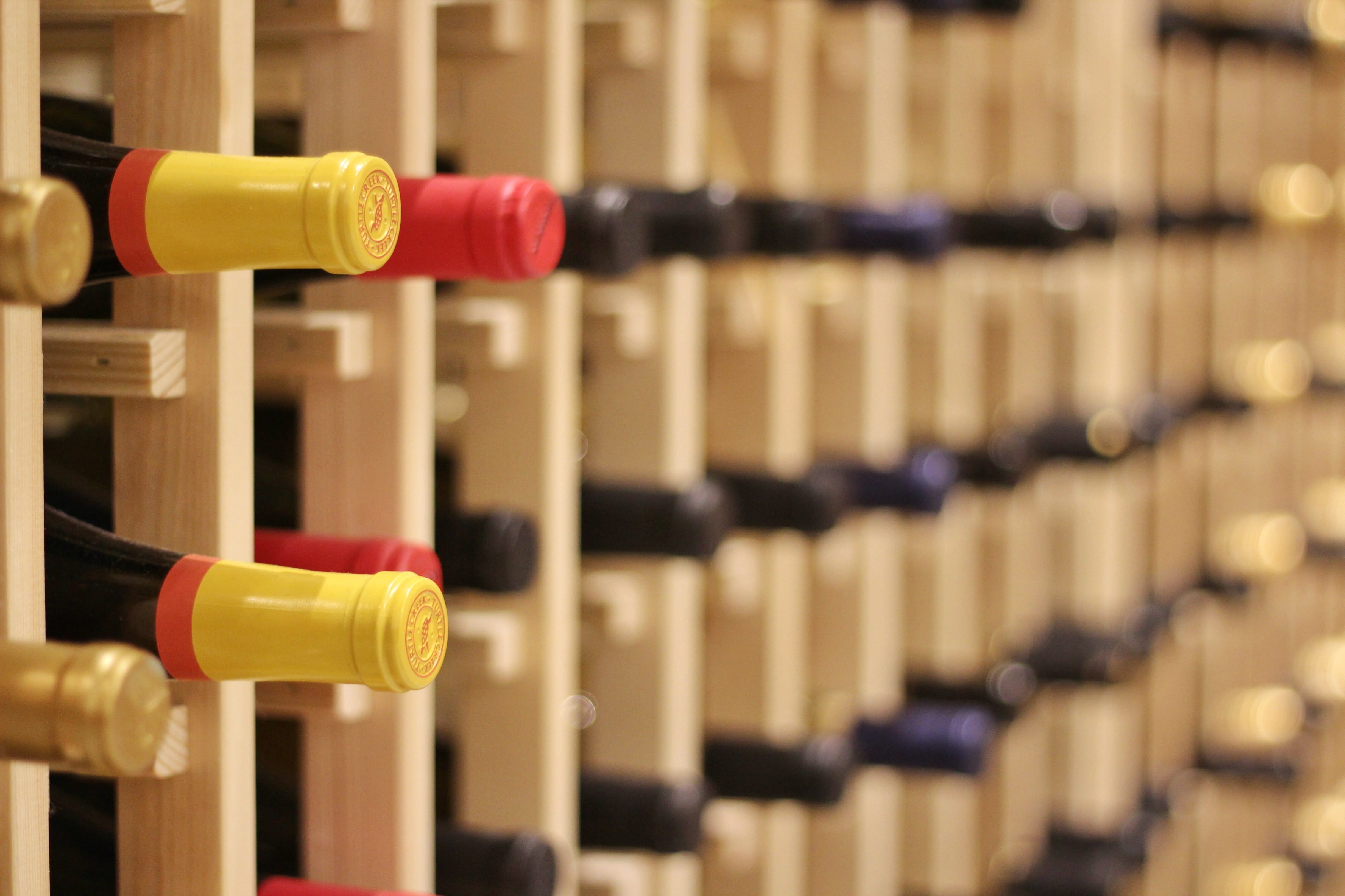 shelf, bottle, red wine, wine rack, rack, indoors, boston public market, in a row, drink, yellow, red, collection, alcohol, market, container, storage compartment, HD Wallpaper