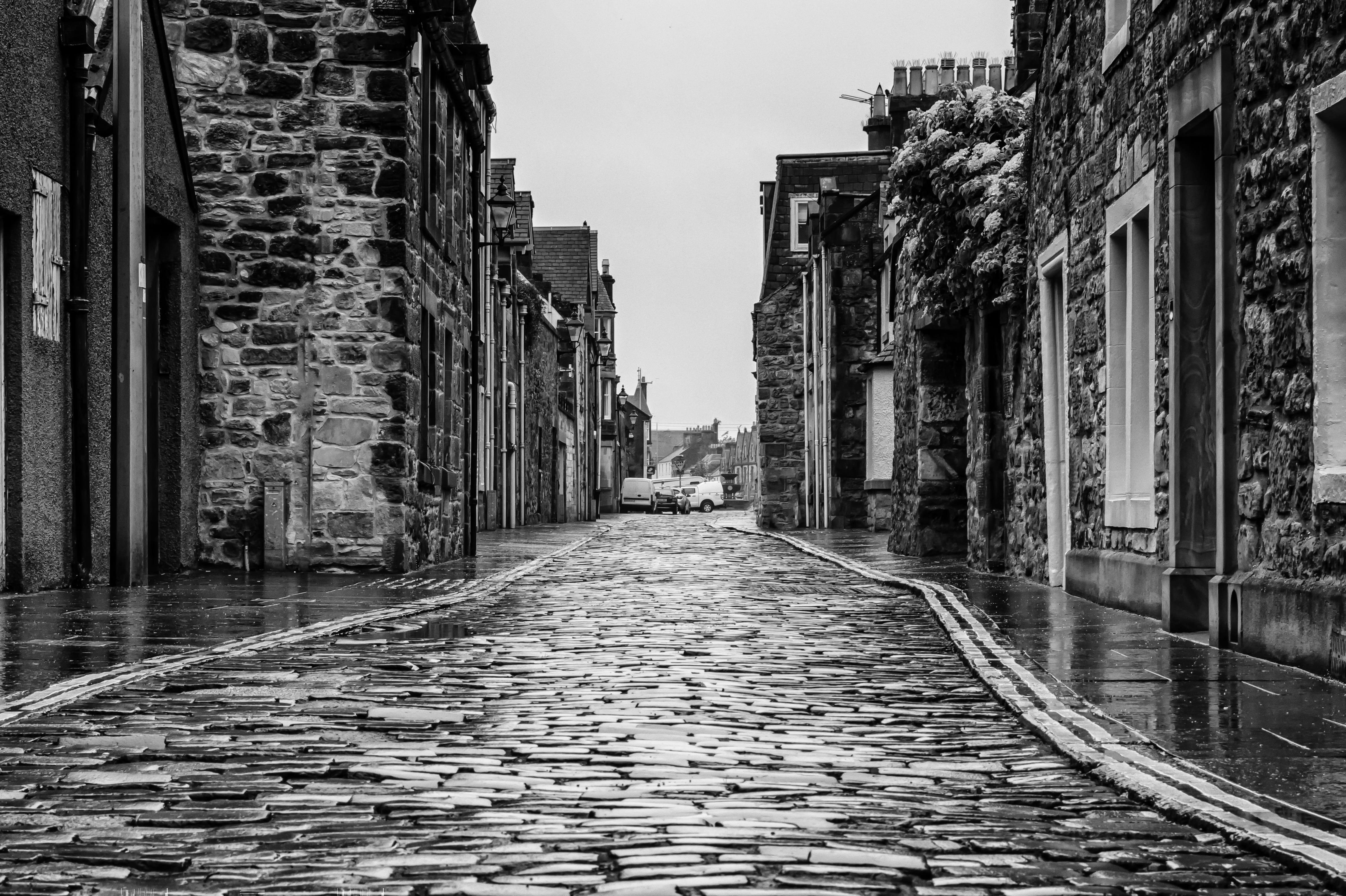 cobblestone, old town, building exterior, outdoors, nature, direction, building, raining, still, rain, empty, mirroring, sky, concrete, grayscale, village, HD Wallpaper
