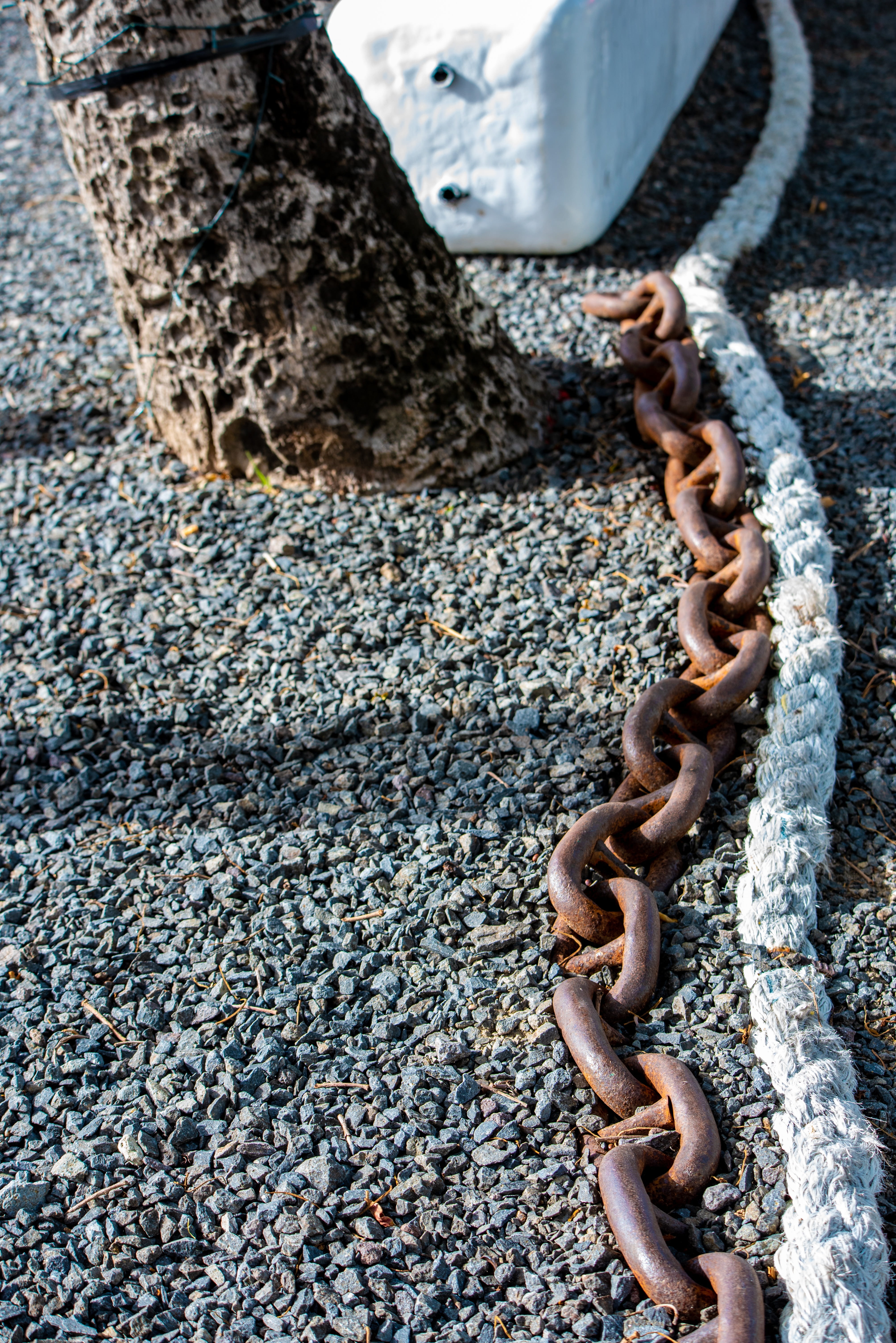 connection, tied up, chain, close-up, boat anchor, metal, solid, 5K, nature, one person, big chain, sunlight, iron, fray, rusty, textured, high angle view, Phone HD Wallpaper