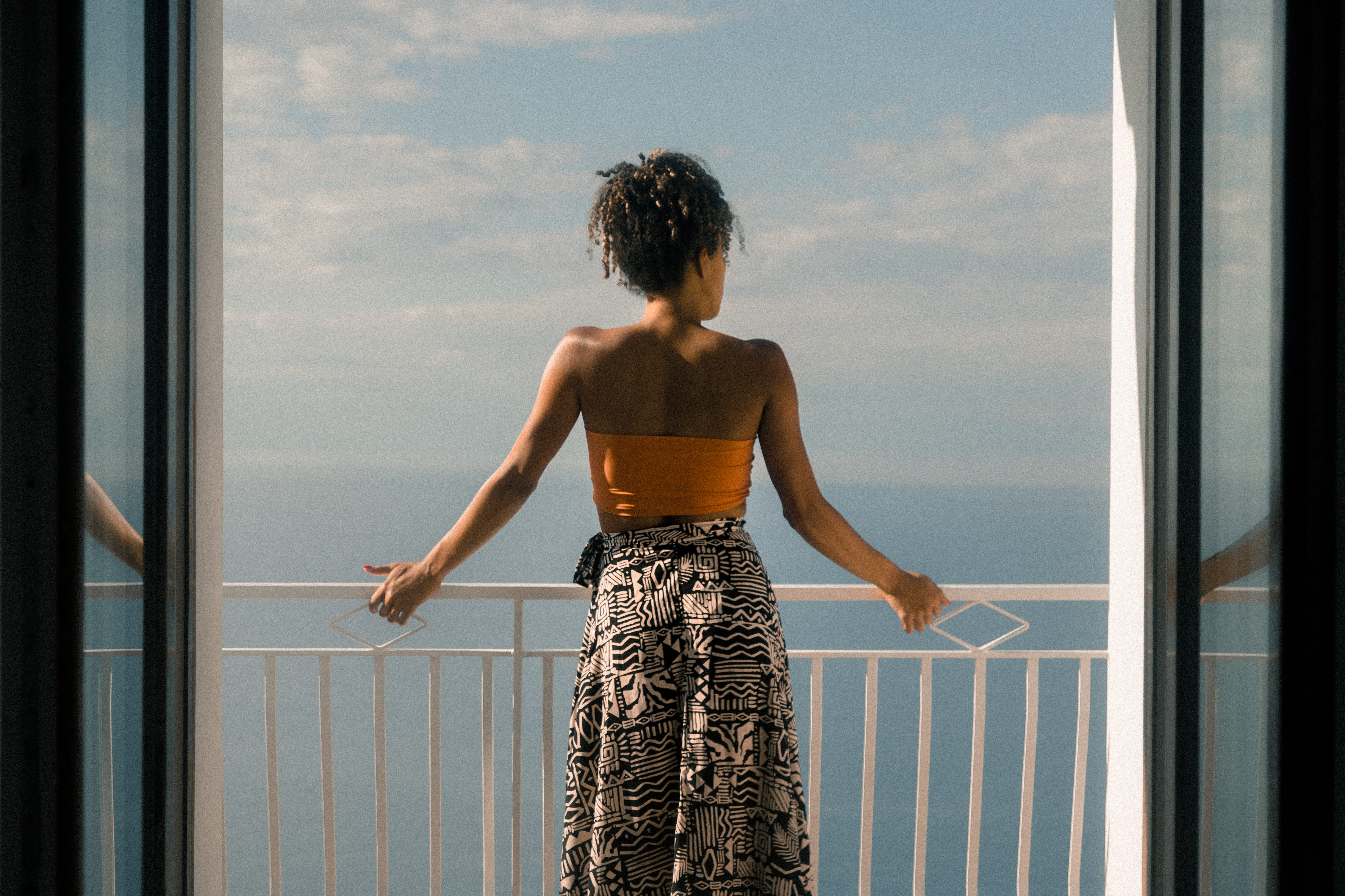 looking at view, adult, young women, sunlight, sunset, clothing, back, standing, black, african american, woman, sunny, behind, balcony, dress, women, sky, HD Wallpaper