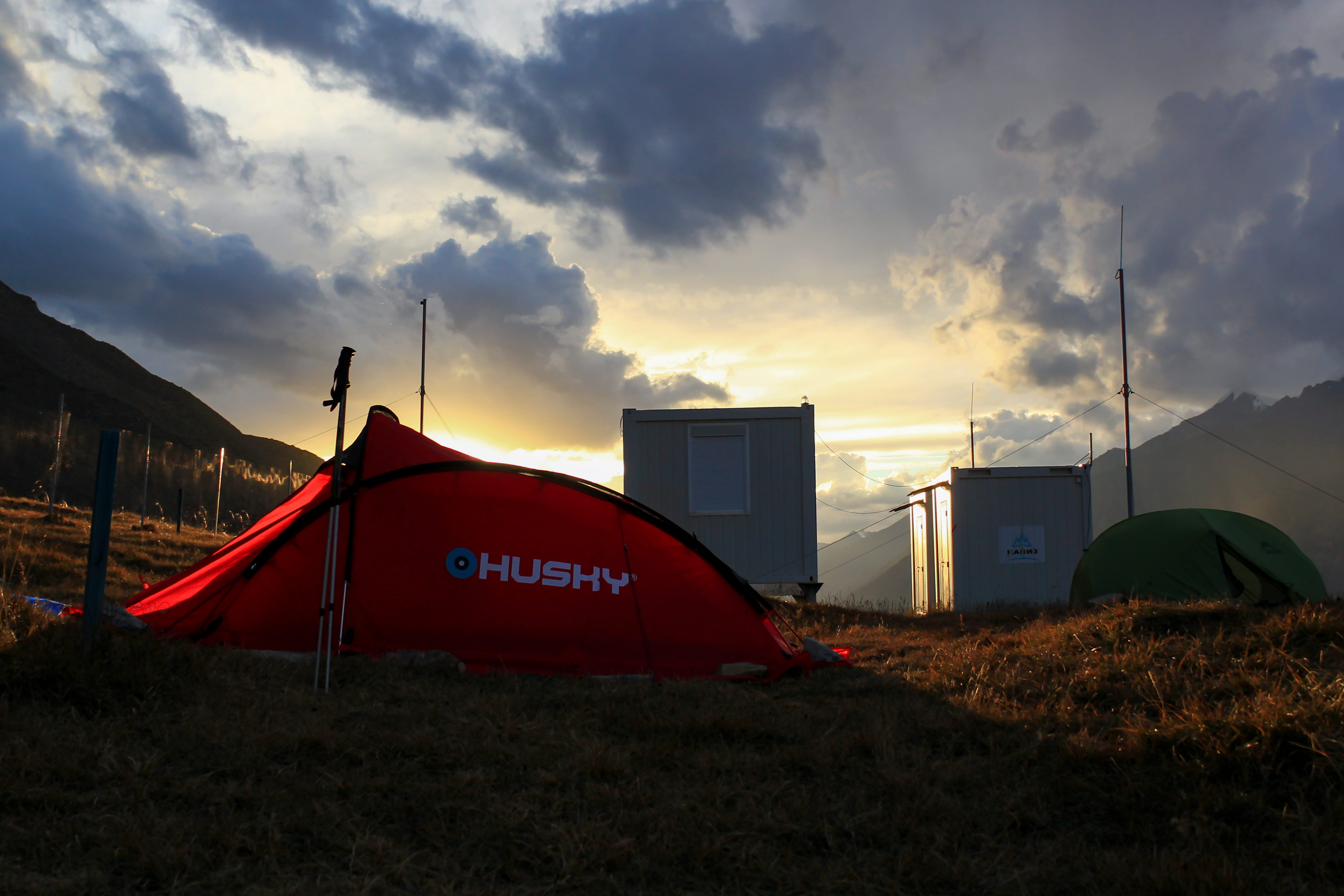 mountains, built structure, tent, red, husky, kyrgyzstan, outdoors, sunset, architecture, 4K, building exterior, grass, plant, field, clouds, mode of transportation, HD Wallpaper