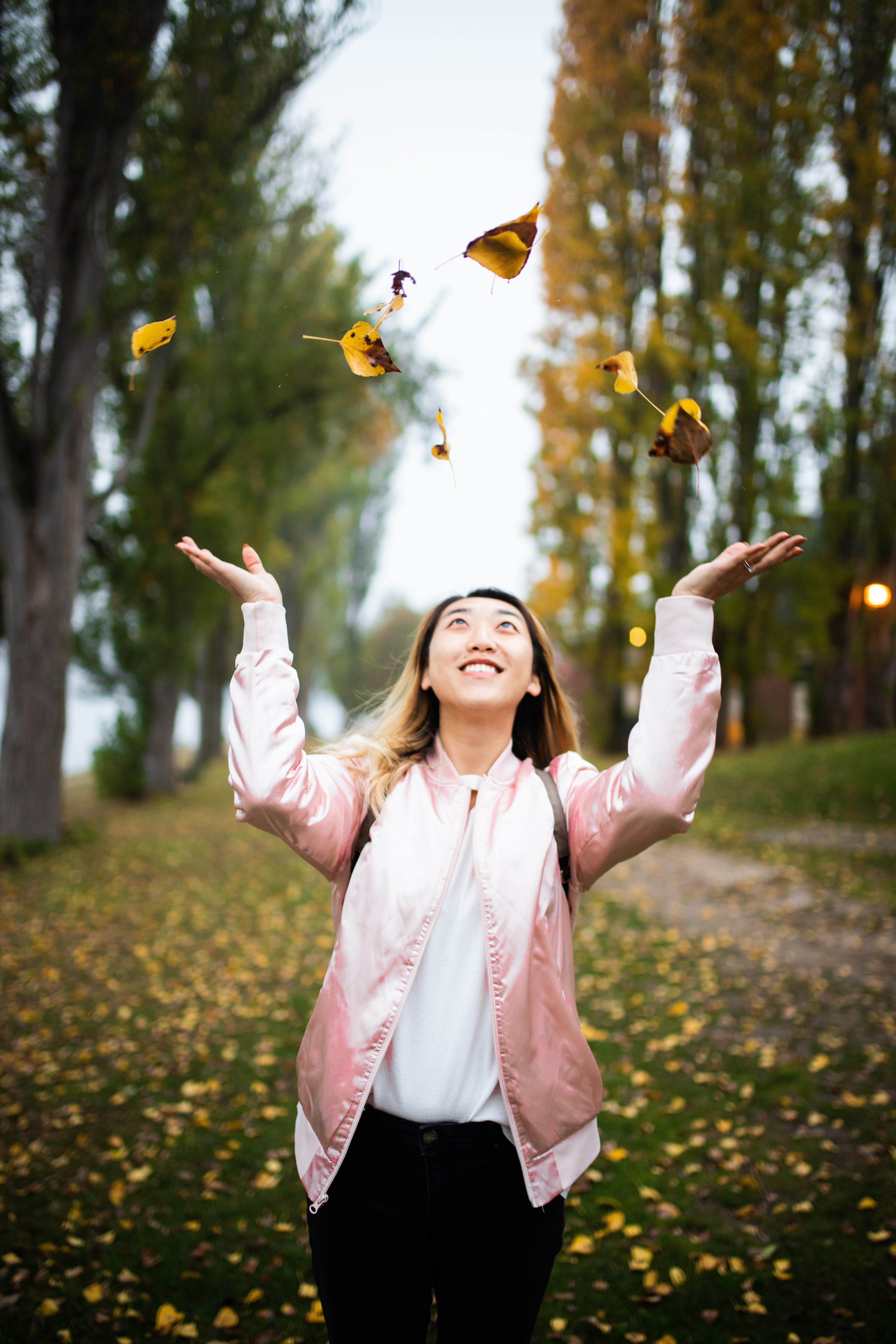 autumn, throw, women, outdoors, real people, 5K, arms raised, mid-air, nature, daytime, human arm, season, lady, throwing, standing, limb, arms outstretched, Phone HD Wallpaper