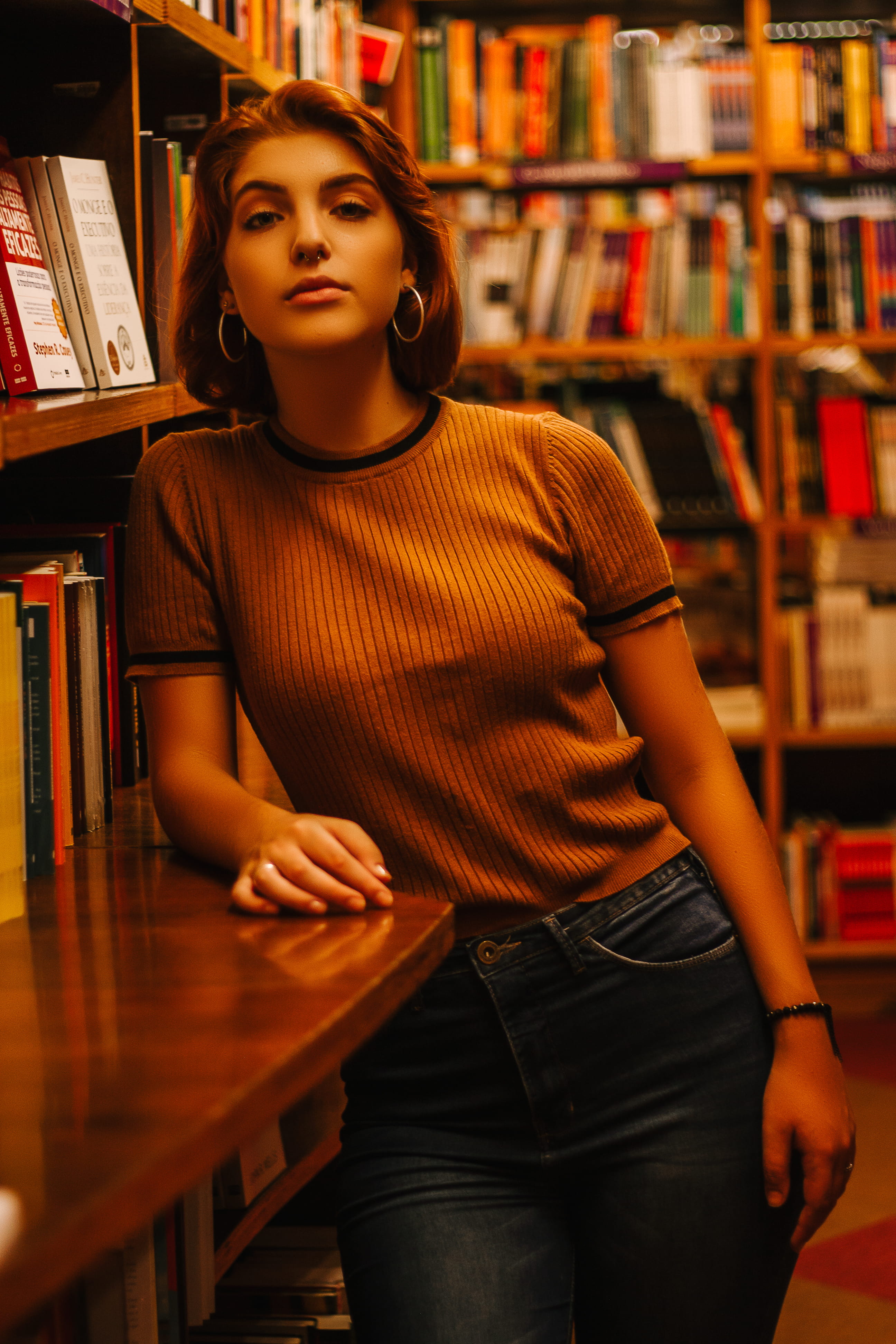 bookshelf, 4K, lifestyles, pose, library, beautiful woman, stylish, leisure activity, looking at camera, young women, real people, woman, casual, make-up, Phone HD Wallpaper